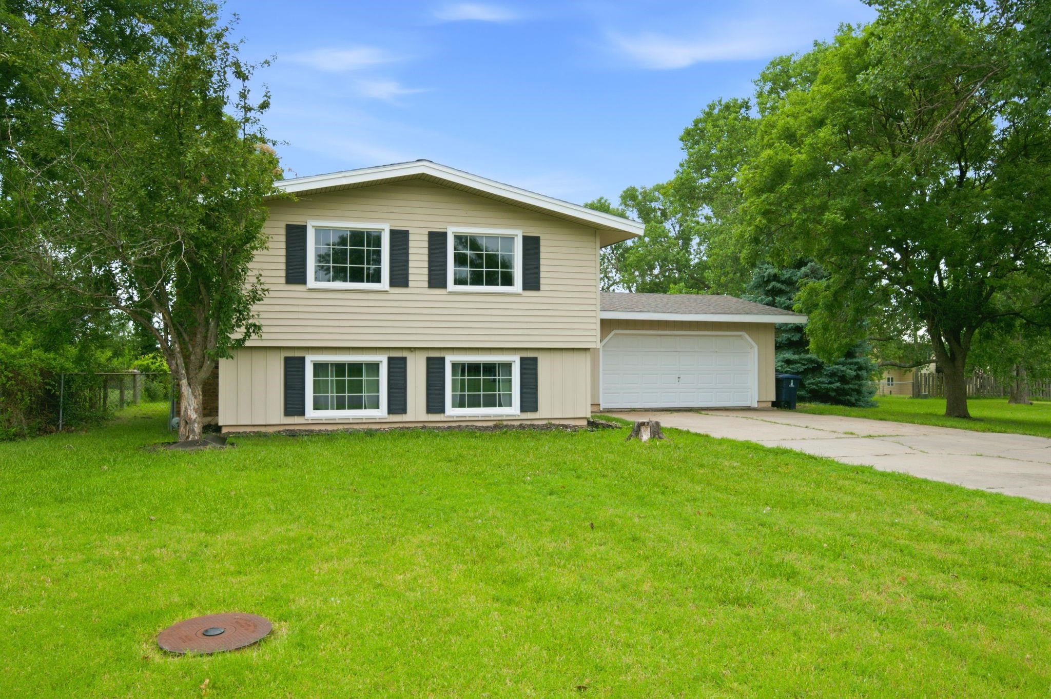 Pride of ownership shines throughout this cute, charming, and well-maintained Bi-Level home offering 3 bedrooms and 2 full baths. The upper level features 1,128 sq ft with two bedrooms, a spacious living room filled with natural light from large windows, a full bath, and a nicely updated kitchen with granite countertops, a cozy breakfast nook area, and all appliances remaining.  The finished lower level adds 1,004 sq ft and includes a private primary bedroom, full bath, expansive family room, and a large laundry/storage area. The entire lower level features large view-out windows, bringing in abundant natural light throughout the space.  Situated on nearly 1/2 acre spanning two lots, this property provides plenty of outdoor space to enjoy, complete with a fenced backyard and patio—ideal for relaxing or entertaining. An attached 2-car garage adds convenience, while major updates include a newer HVAC system (approximately 4 years old) and a roof replaced in 2018. This is a solid, move-in ready home with space, updates, and room to grow.