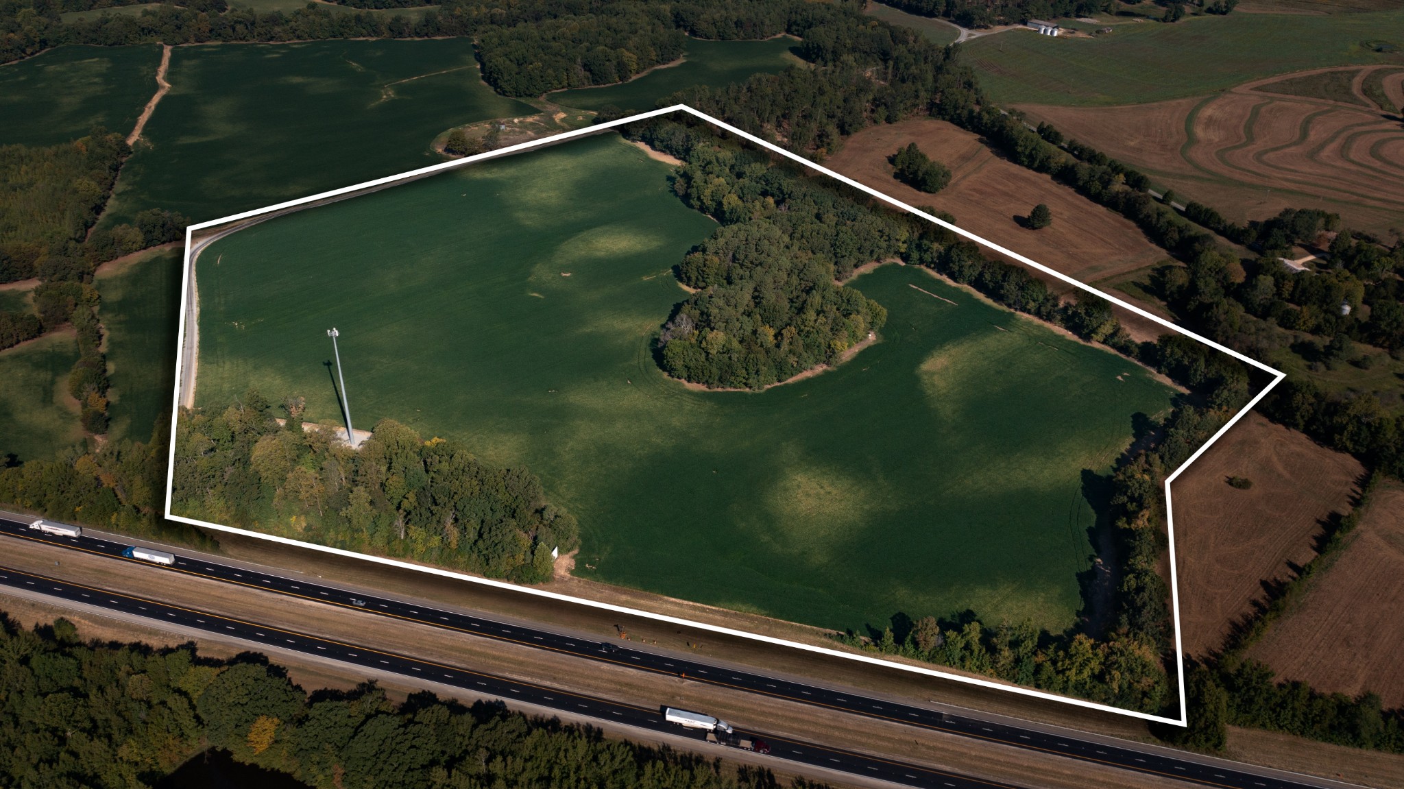 49+ Acres in the Opportunity Zone!Seize the chance to own 49+ level acres located in a designated Opportunity Zone, offering significant tax incentives for new businesses and investors. This expansive property stretches as far as the eye can see, with over 3,400 feet of road frontage and commercial power already on site, making it ideal for a wide range of uses.Whether you envision a dealership, warehouse, amusement park, distribution hub, or another masterful development, the possibilities here are truly endless. The land’s size and layout make it adaptable for virtually any industry or large-scale vision.In addition to its development potential, the property is just minutes from recreational hotspots, offering convenience while still positioned for growth.With the added advantage of Opportunity Zone tax breaks, this property isn’t just land—it’s a long-term investment in Tennessee’s future