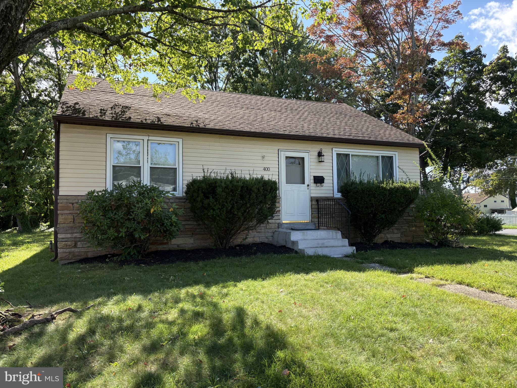 Professional photos are coming September 23. Showings begin September 24. Welcome to a truly rare find, 400 Maple Street. For the past 50 years, this home has had just one owner. Now completely renovated, it is ready for its next chapter. Situated on a corner lot in a quiet residential pocket of Warminster, this home offers a peaceful setting while remaining so close to everything. Step inside to a floorplan that has been opened up to create a natural flow from the spacious living room to the dining area. Just beyond, you’ll find a brand new eat-in kitchen. New cabinets, backsplash, quartz countertops, and stainless steel appliances await your culinary creativity. While preparing meals, you can gaze out of the box bay window overlooking the backyard and brand new deck. The home offers three comfortable bedrooms and two full bathrooms, including a convenient hall bath situated between two of the bedrooms and a private en-suite in the primary. Generous closet space provides ample storage while leaving plenty of room to make the home your own. A large walk-in closet just outside the primary bedroom provides even more flexibility. Updates include new premium LVP flooring, new central HVAC, and all new windows, along with updated plumbing and electrical and fresh paint throughout. Enjoy added peace of mind with a newer shingle roof, along with a brand new rubber roof over the rear portion of the home. The full unfinished basement provides additional storage, washer and dryer, and a brand new oil tank, along with a section that is partially framed for future finishing. The Warminster SEPTA Regional Rail station and PA Turnpike are both just minutes away. When you return home, enjoy the convenience of your own private driveway. Move right in and enjoy easy access to shopping, dining, and parks, while being part of Centennial School District and the Warminster community.