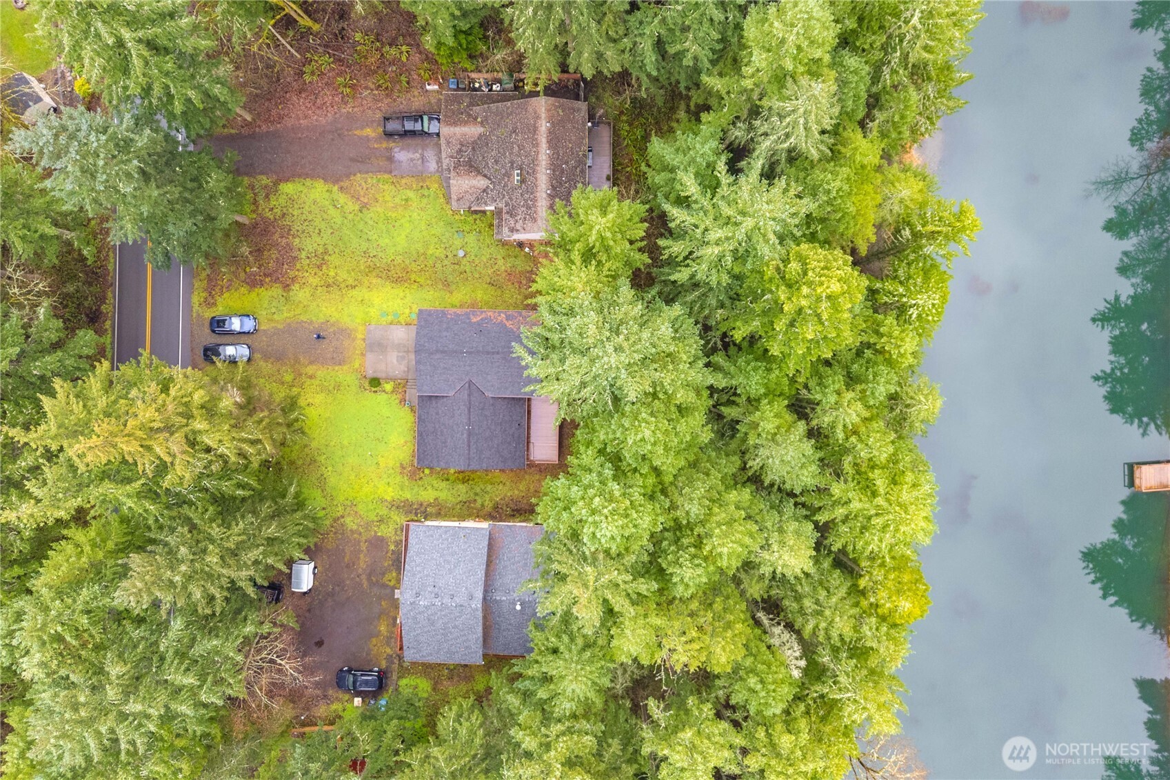 3-bedroom plus office, 2-bath home with stunning views of Horse Shoe Lake. Privately situated, this home offers the perfect blend of comfort, style, and functionality. Step inside to an open living room with vaulted ceilings, a cozy fireplace, and charming window-seat box seating. Natural light fills the space, showcasing peaceful lake views. The kitchen is both stylish and practical, featuring ceramic tile flooring, crisp white cabinetry, ample storage, generous counter space, new stainless steel appliances. Upstairs, you’ll find all three bedrooms, including a spacious primary suite with a walk-in closet and an ensuite bath. Two additional bedrooms and a full bath complete the upper level. Downstairs offers a versatile family room and den/office—perfect for remote work, hobbies, or additional living space. Enjoy outdoor living from the dining room deck or unwind with your morning coffee while taking in the serene lake views. The finished garage features an epoxy-coated floor, and the spacious driveway provides ample parking. Recent updates include fresh interior paint, new carpet throughout and a brand new roof. Located in a gated community offering lakes for swimming, fishing, and kayaking, along with sports courts, parks, picnic areas, an indoor/outdoor pool, and miles of walking trails—you can truly live like you’re on vacation year-round. Conveniently close to Yelm, Olympia, and JBLM, this is a must-see gem in a peaceful, amenity-rich setting.