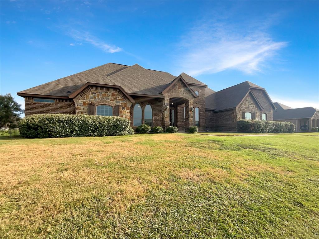Exceptionally maintained transitional gothic design, 4 Bedroom plus dedicated home office. 3 full bathrooms, situated on a nearly 1 acre corner lot in Eagle Mountain ISD features hand scraped hardwood, granite counters, walk in pantry, split bedroom floor plan, mudroom, indoor and outdoor fireplaces, incredible spa like primary suite bath and Texas sized walk in closet! If you've got boxes to check, this home checks them all and more. Schedule your private showing today and start packing! Some photos may be virtually staged.