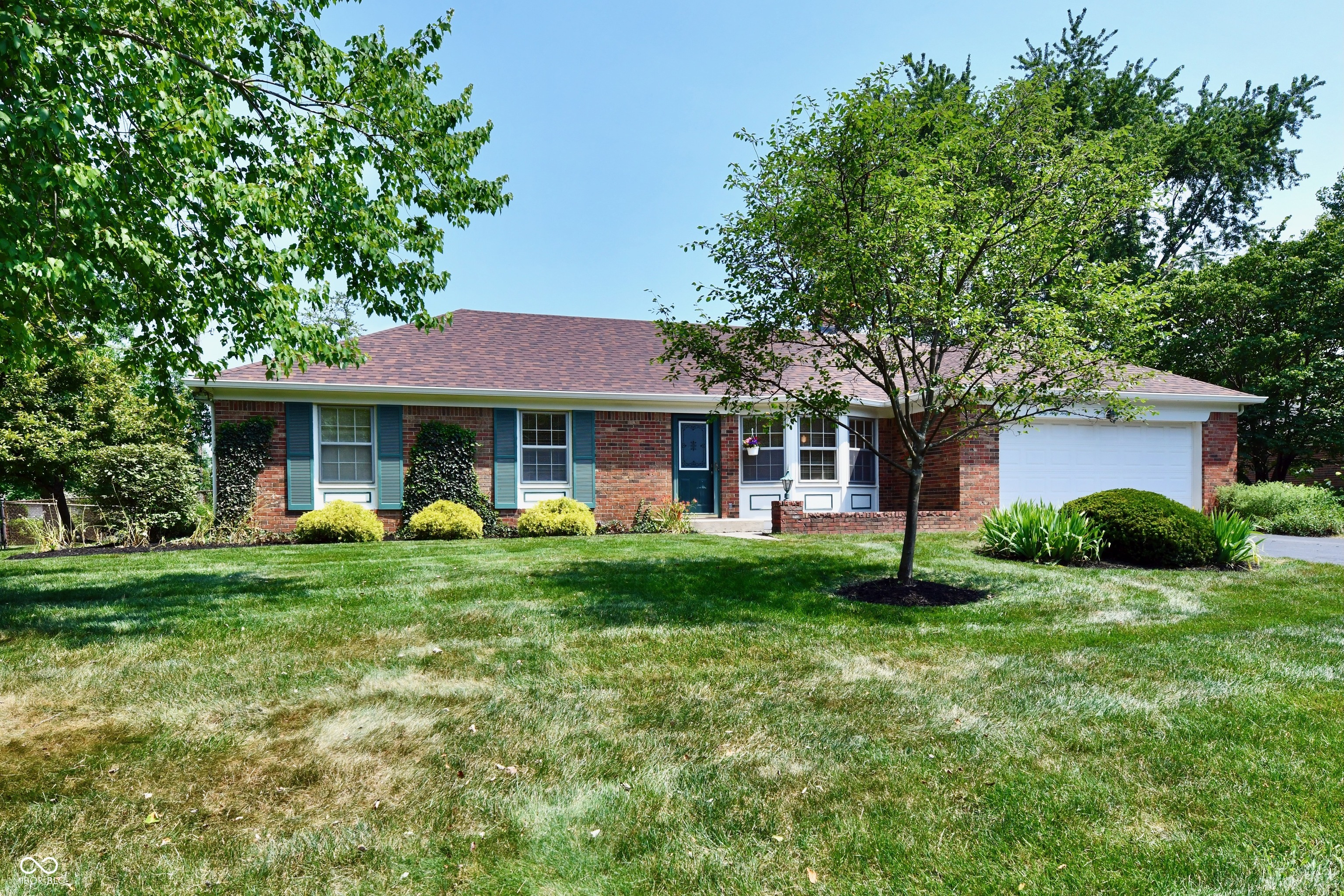 Welcome home! This pristine, move-in-ready all-brick ranch offers the perfect blend of comfort and unbeatable convenience. Located just minutes from Conner Prairie, the Nickel Plate Trail, parks, top-rated schools, shopping, and dining, the location truly can't be beat. Nestled on a generous lot with mature trees and beautiful landscaping, the property boasts a fully fenced backyard. You will love the charming screened porch-the ultimate spot for your morning coffee! Step inside to discover timeless hardwood flooring throughout, and solid wood six-panel doors. Bright and sunny living room with bay window.  The inviting family room features a raised-hearth fireplace.  Roof replaced 2025, Water Heater 2023, updated electrical, added insulation, and more improvements providing a very well maintained home.  Attached 2 car garage w/GDO and pull down stairway. All kitchen appliances, plus the washer and dryer, are included.
