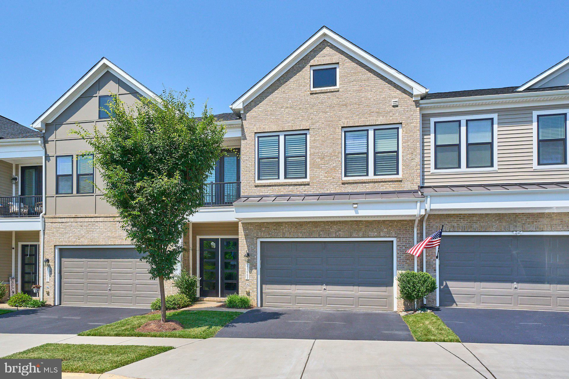 Welcome home to this spectacular Van Metre Schumann model, beautifully appointed with premium upgrades and featuring a luxurious main-level primary suite in the highly sought-after 55+ community of Birchwood at Brambleton.The heart of the home is the gourmet kitchen, thoughtfully designed with upgraded Level 5 cabinetry extended to the ceiling, an oversized center island, in-cabinet lighting, upgraded granite countertops, and a premium stainless steel appliance package featuring a wall-mounted range hood and convection oven. A stylish barn door leads to the laundry room, complete with built-in cabinetry for added convenience.The spacious main-level primary suite offers a true retreat with two walk-in closets and a spa-inspired bath featuring upgraded Level 5 cabinetry, designer tile throughout, and a thoughtfully designed layout with a private separate shower and water closet.The inviting living room opens to a spacious fenced patio with a retractable awning—an ideal setting for relaxing or entertaining outdoors.Upstairs, you'll find a generous loft that provides the perfect second living area, along with two large bedrooms, a full bath, and abundant storage. Whether hosting overnight guests, creating a home office, or enjoying additional living space, the upper level offers exceptional flexibility.The oversized two-car garage provides plenty of room for parking and additional storage.Residents of Birchwood at Brambleton enjoy exclusive access to an impressive 20,000-square-foot clubhouse overlooking a picturesque 14-acre lake. Resort-style amenities include indoor and outdoor pools, a state-of-the-art fitness center, demonstration kitchen, indoor and outdoor bars, theater and game rooms, art studio, golf simulator, pickleball and bocce courts, greenhouse and garden area, social gathering spaces, and a fishing pier with catch-and-release fishing.Just minutes away, Brambleton Town Center offers exceptional convenience with restaurants, shopping, a library, a 16-screen movie theater, and a full-service fitness club. The home is also ideally located near Loudoun County's renowned wineries and breweries, major commuter routes, and Dulles International Airport, providing easy access to everything Northern Virginia has to offer.