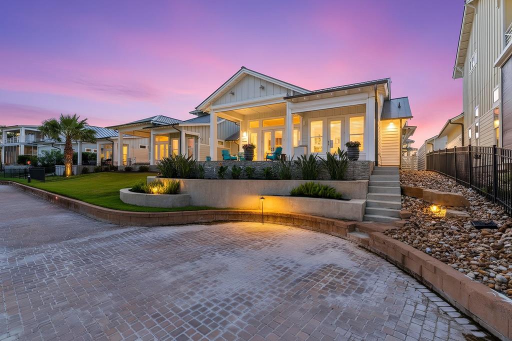 Exquisitely crafted, this single-story waterfront estate delivers custom luxury and effortless coastal living in one of Rockport's most prestigious gated communities. Breathtaking views of protected wetlands and the Aransas National Wildlife Refuge serve as your permanent backdrop &mdash; with spectacular sunrises over the water to greet you each morning. French doors from the primary suite open to an extended, fully tiled rear porch complete with roll-down hurricane-rated shades and an outdoor beverage fridge &mdash; your private sanctuary for morning coffee or evening cocktails. Inside, every detail shines. Custom solid wood cabinetry with glass uppers frames a gourmet kitchen featuring KitchenAid appliances, a Bertazzoni gas range, and quartzite countertops. Artisan tile flooring runs throughout, complemented by hand-selected fixtures on dimmers, plantation shutters, and custom barn doors. The primary suite offers a true retreat with a soaking tub, joined by two additional guest bedrooms. Outdoors, a front courtyard with an outdoor kitchen and artificial turf sets the stage for unforgettable entertaining. The approximately 440 sq ft casita impresses with an open-concept layout, dry bar, kitchenette, and full bath with walk-in shower. Systems match the finishes: Kohler whole-home generator, whole-house surge protector, water filtration system, 80-gallon water heater, security cameras, mosquito misters, and a climate-controlled two-car garage. All within a gated community featuring a resort-style pool, 2+ mile nature path, and community pier. Properties of this caliber, in this location, are extraordinarily rare.