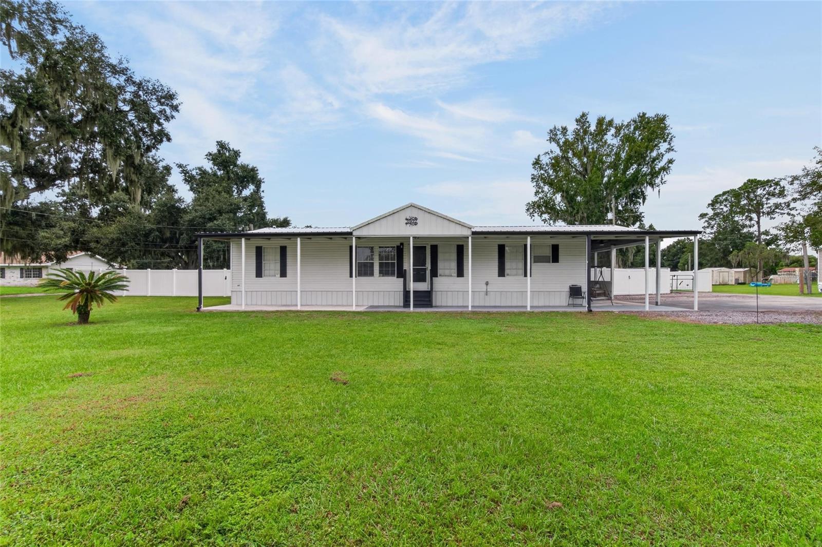 Beautiful Plant City property with exceptional workshop and storage space! This warm and inviting 3-bedroom, 2-bathroom home sits on a fully fenced 0.8-acre lot. A rare find for hobbyists, tradespeople, and buyers who need room to work and store equipment. A bonus flex room works well as an office, gym, or playroom, while the inviting screened-in patio is perfect for relaxing or entertaining outdoors. Enjoy country living with convenient access to major roadways, downtown Plant City, and shopping. Property Highlights:• Recent upgrades: Anchors (2026), Roof (2023), Hot Water Heater (2026), Fencing (2025).• 52x40 metal building with 3 Bays (2025), ideal for a boat, equipment, vehicles, or a serious workshop.• 20x20 enclosed shed with electricity and a 30-amp hookup, plus a 14x24 carport.