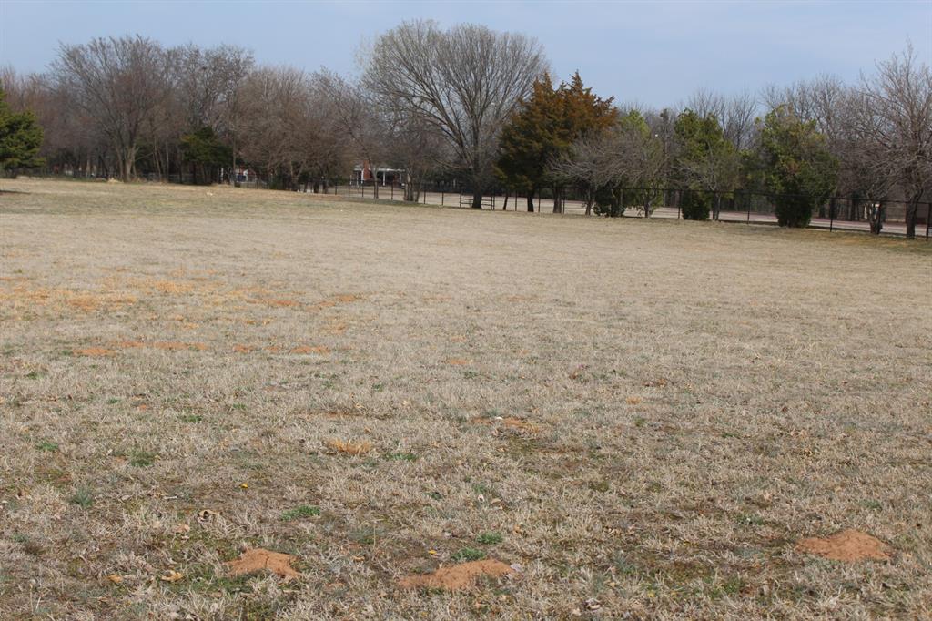 Nicely treed 3 acre lot in Norman.  Located right on 320th, just west of Santa Fe, with the Woodland Housing subdivision across the street. Riverwind Casino near by, but not close enough for traffic issues. Owner may subdivide into 3 one acre lots if necessary.  Beautiful, flat land.  Buyer to verify school information.