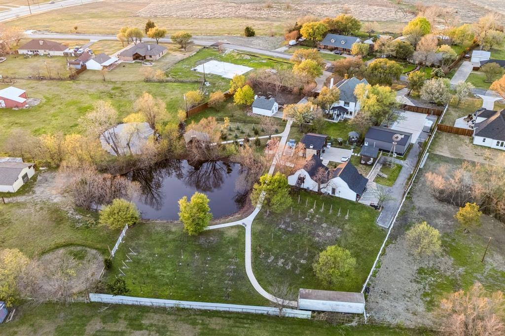 Welcome to Your Private Oasis in Rowlett!Discover this stunning 3,874 sq. ft. luxury home nestled on a serene 2.48-acre private estate, just half a mile from George Bush Turnpike and Firewheel Town Center. This property is truly one-of-a-kind, offering a perfect blend of elegance, comfort, and resort-style living.The main residence boasts 4 spacious bedrooms, elegant fixtures, and designer upgrades throughout—including quartz countertops, porcelain backsplash, and sparkling crystal chandeliers. With a new roof and new AC units, peace of mind comes standard.Step outside and experience an entertainer’s dream! The property features:ADU's are all fully furnished with brand new furnitures and it all can come with acceptable offer.Two  barn-style another ADU's with camping area.A charming cabin retreatPicturesque vineyard & pondMetal garage,workshop and lots of parking area for boats , RV and multiple vehicles.Pavilion & outdoor spaWhether you’re seeking  a private retreat, this estate offers unmatched versatility and value. Your dream of hosting unforgettable gatherings, creating a family compound, this property delivers.Location, luxury, and lifestyle—this property has it all. Don’t miss your chance to own a rare gem in Rowlett!POOL permit is ready and could be done in 3 weeks time if buyer decides to add it.Seller offering up to $50,000 in buyer incentives with acceptable offer. Terms and conditions apply.