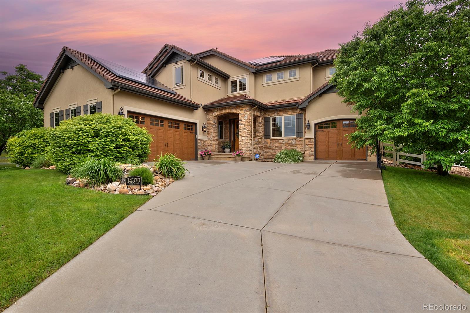 Tucked at the end of a quiet cul-de-sac and backing to open space, this beautifully designed home pairs rare privacy with unmatched convenience—just 20 minutes to Boulder, 25 minutes to downtown Denver, and 30 minutes to DIA.

A low-maintenance concrete-tile roof and stucco/stone exterior frame a heavily treed backyard that feels like a private park, perfect for outdoor gatherings. Inside, the main level balances elegance and functionality with formal living and dining rooms, an open family room–kitchen layout, and a double home office with a two-sided fireplace and custom built-ins.

The kitchen features a custom wood hood, upgraded appliances, solid knotty-alder doors, and refreshed lighting. Comfort is guaranteed year-round thanks to two brand-new Bosch HVAC/heat-pump systems, a tankless water heater, and a three-zone smart thermostat setup—$42k in recent upgrades.

Upstairs, a versatile loft, upgraded secondary baths, and an ultra-convenient laundry room support modern living. The finished basement impresses with a large entertainment area, custom wet bar, temperature-controlled wine cellar, full home gym with professional rubber flooring, and bonus space currently used as a dance and hockey room.

Additional highlights include upgraded Toto toilets, solid wood plantation shutters throughout, an oversized three-car garage with epoxy floors, and designer lighting. Premium Pella Lifestyle Series doors and a new smart irrigation system with landscape lighting elevate comfort and efficiency. Warm, thoughtfully upgraded, and ideally located, this home delivers exceptional comfort and style with quick access to Boulder, downtown, and the airport.