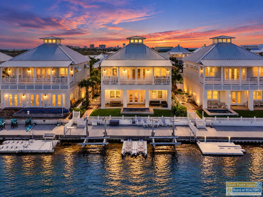 Stunning Bayfront Retreat with Breathtaking Water Views! Experience the ultimate in waterfront living with this gorgeous, fully furnished bayfront property located in an exclusive gated subdivision. Offering 2,696 square feet of beautifully appointed living space, this exceptional four-bedroom, four-bath residence combines coastal elegance, comfort & spectacular views of the bay. The spacious kitchen offers abundant room for cooking and entertaining, while the dining area provides a beautiful setting to enjoy meals overlooking the sparkling water. Take in the breathtaking scenery from the expansive covered patio or unwind on the large balcony, both offering incredible views of the bay and creating the perfect backdrop for relaxing or entertaining family and friends. Enjoy the convenience of a private boat lift for effortless access to the water. Community amenities include, Pool, basketball, volleyball, pickleball & private beach access.