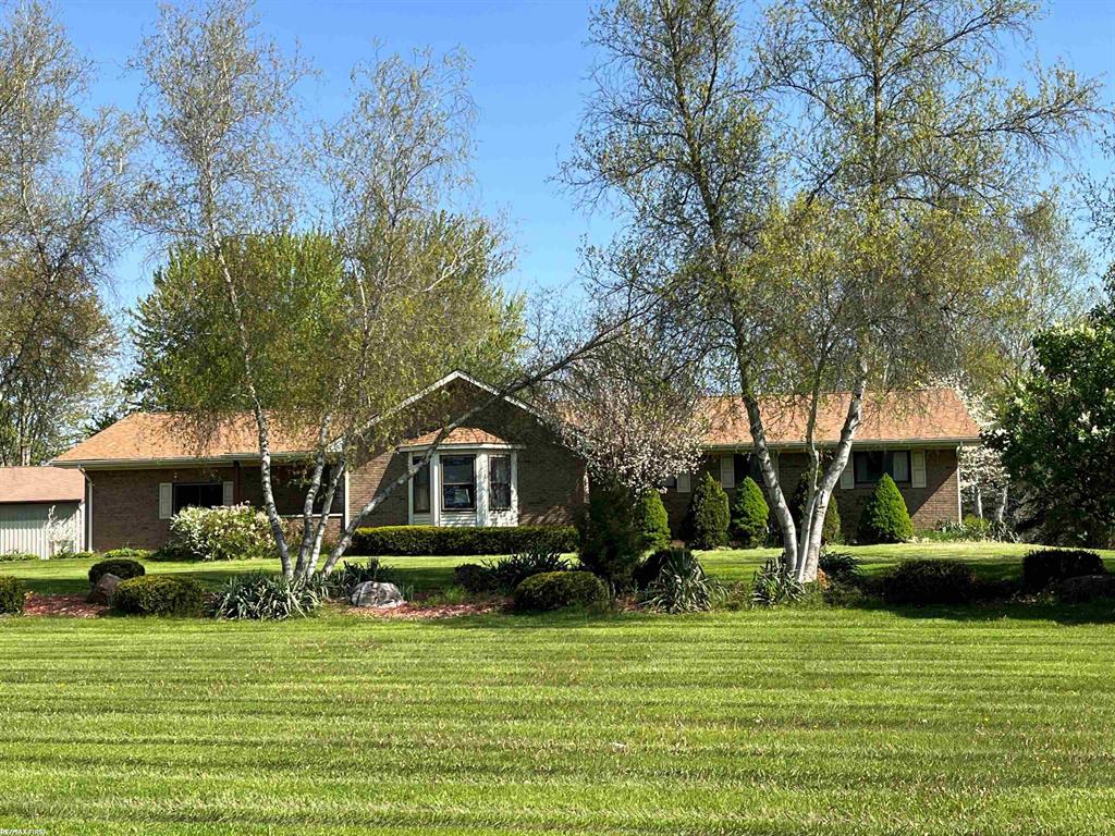 20 beautiful acres in prime Armada near Blakes Apple Orchard, Pine Valley Golf course.  Newer upgrades include furnace, c-air, HWH, huge pole barn and private pond, unbelievable views with black walnut trees on property.  First floor laundry, huge rooms, cathedral ceilings...Apple trees, sun porch, deck, new water softener, holding tank, well points, insulated garage door, glass block basement windows, newer roof barn.  Pole barn 40x160 with 10' overhead power door.  220+ multiple electric.  Home needs paint and flooring.  Unbelievable property with trail.  New Hardwood Like flooring will be installed this week in great room and hallway