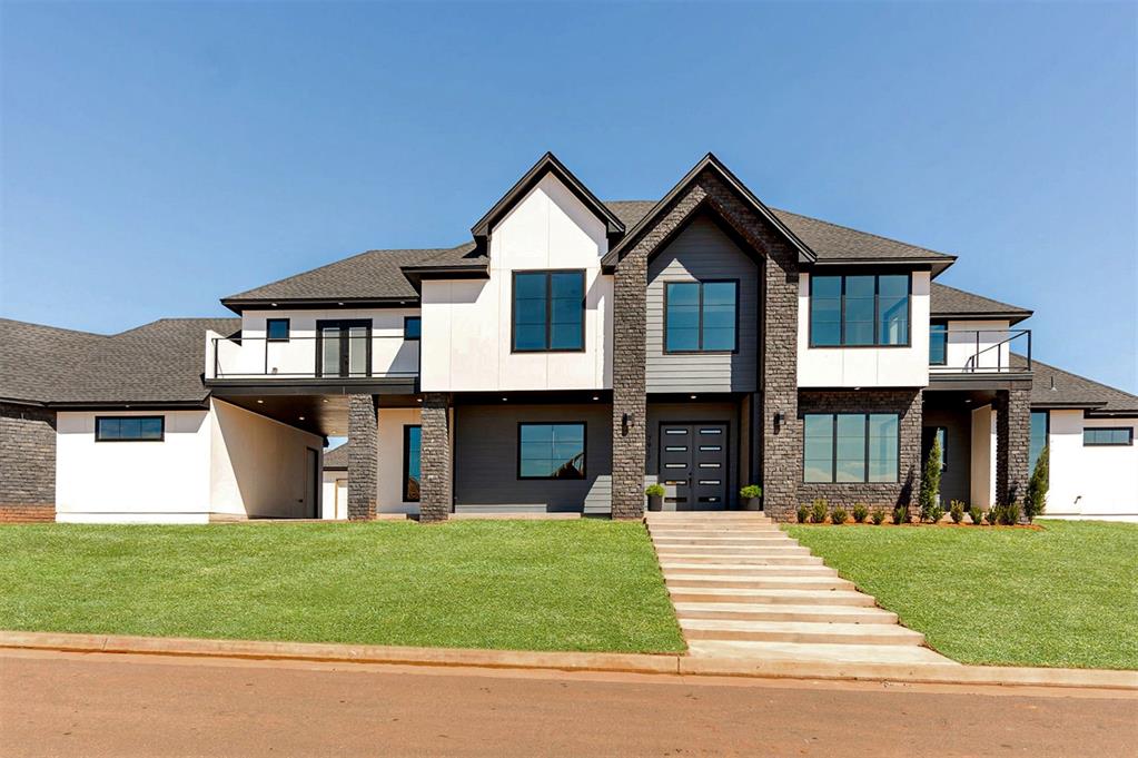 A striking example of contemporary craftsmanship tucked away in a tranquil cul-de-sac, this residence offers 4,471 square feet of impeccable design on over a quarter-acre lot. With a layout that effortlessly balances form and function, this home is tailored for versatile living and refined entertaining. Inside, discover a living room that is nothing short of breathtaking, where dramatic double-height ceilings and oversized picture windows invite an abundance of natural light. A sleek fireplace anchors the space, creating a perfect blend of grandeur and warmth. The gourmet kitchen, showcases Monogram appliances, abundant storage, floating shelves, and a large central island that invites connection. Adjacent to the kitchen, a generously sized pantry offers additional storage that ensures every culinary need is met with ease.. The dining area is ready for intimate meals or lively gatherings, seamlessly extending to the outdoors through sliding glass doors, revealing a serene patio perfect for alfresco dining or quiet relaxation. The expansive owner's suite is a haven of tranquility, featuring vaulted ceilings, a spacious walk-in closet, and a spa-like ensuite with a dual-head steam shower and a freestanding soaking tub. A second primary suite on the main level offers its own slice of luxury, and doubles as a mother-in-law suite. With sliding doors to the patio and a moody, elegant ensuite bath. Completing the first floor are a functional mudroom, a large laundry room, and a private study, each designed with thoughtful precision. Upstairs, a sunlit landing leads to a secluded balcony. Two additional bedrooms, each with their own ensuite bath, provide comfort and privacy for family or guests. This home is as sturdy as it is stunning, built on a post-tension slab that ensures durability and peace of mind for years to come. Every detail of this residence, from its flawless flow to its premium finishes, captures the true essence of luxury living.