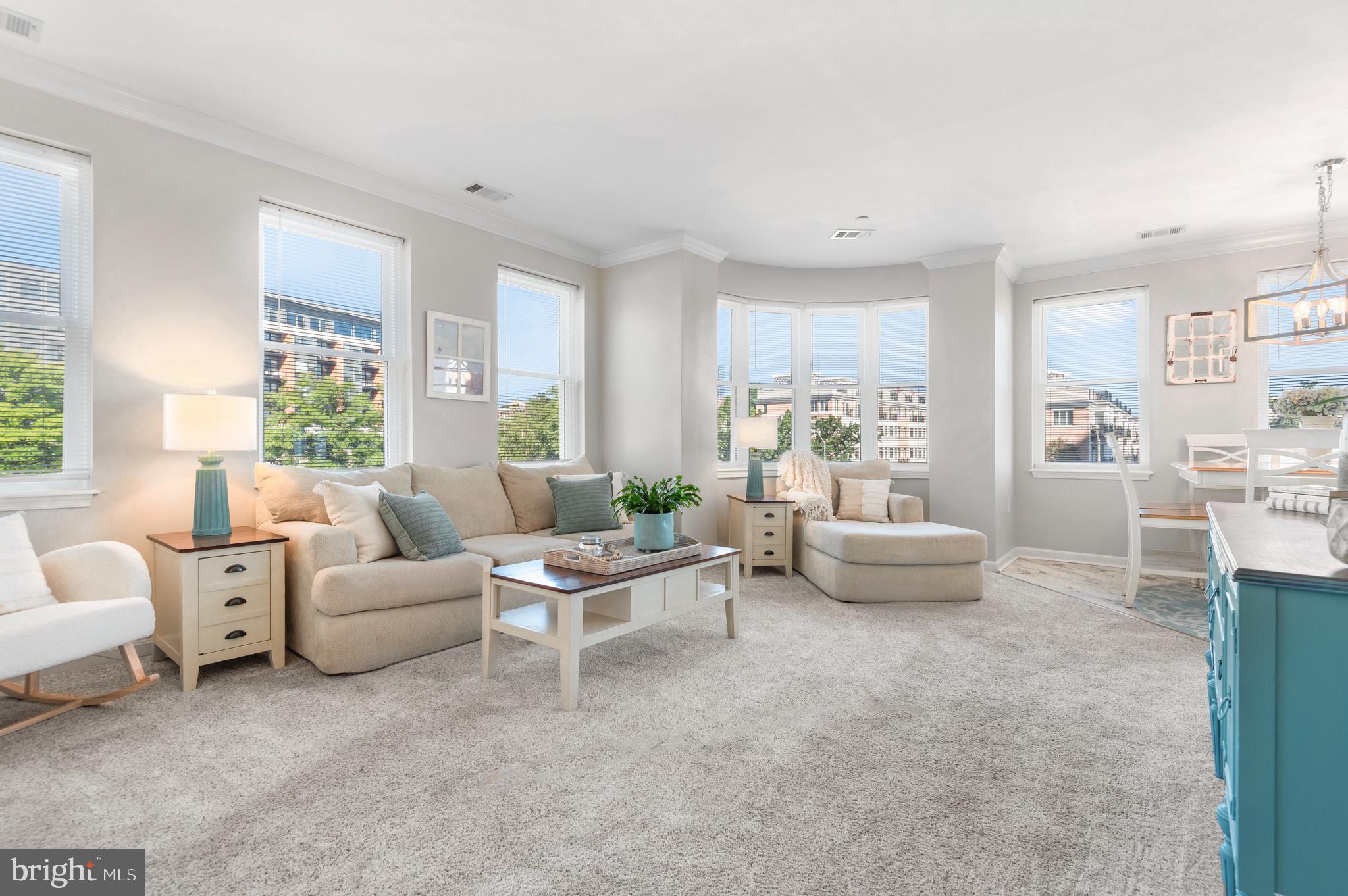 Price improvement! Now offered at $339,900.  23 Pierside Drive #221 offers luxurious waterfront living where light-filled interiors, harbor views and a private balcony come together in an exceptional Baltimore City setting. Expansive windows and extra-high ceilings create an open, airy feel throughout the living and dining spaces while bringing city skyline and water views front and center.  Thoughtfully renovated with high-end finishes throughout, this residence features two en-suites positioned in a split floor plan, creating ideal privacy for guests or everyday living. Extensive updates include the renovated kitchen and baths, cabinetry, countertops, backsplash, lighting, flooring, carpet, appliances, double oven, HVAC, hot water heater, windows, sliding glass doors, blinds, and more.  An oversized deeded parking space, P0-182, conveys with the unit, a valuable feature not included with every residence in the building. The condo can also convey furnished, with only a few exclusions, if desired by the buyer.  Pierside residents enjoy 24-hour concierge service, outdoor pool access, fitness centers, and an unbeatable location along the waterfront. Just outside your door are Baltimore’s best restaurants, marinas, Harbor East, and walkable access to Orioles and Ravens games.  A move-in ready Inner Harbor retreat with style, light, and views in every direction.