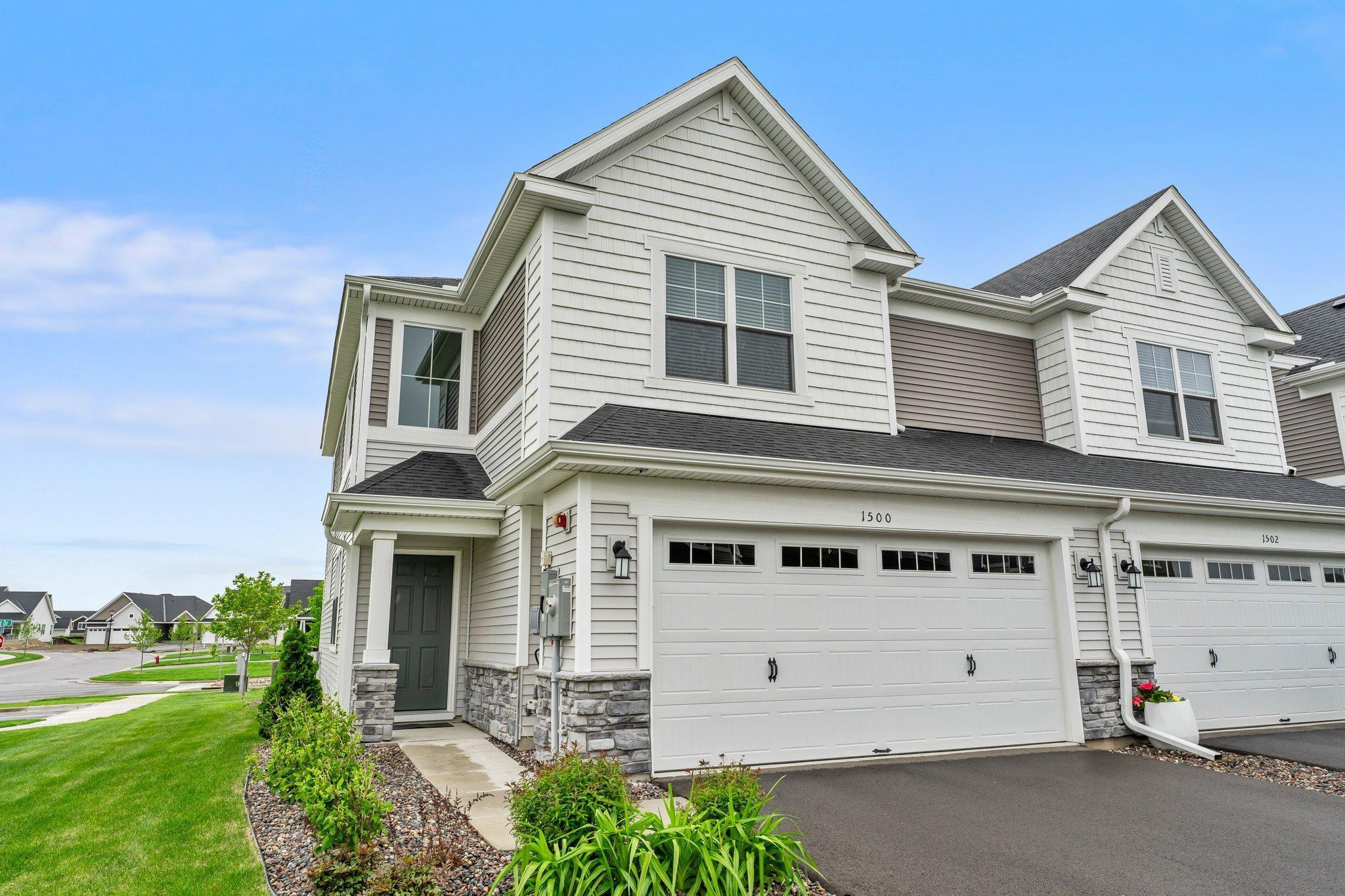 Welcome to this stunning 3-bedroom, 3-bathroom end-unit townhome, newly built in 2022 and nestled in a beautifully developed community in Carver. This move-in-ready home requires no updates and offers the perfect blend of comfort and convenience. Enjoy maintenance-free living with exterior upkeep, landscaping, lawn care, and snow removal all included in the HOA. As you step inside, you're greeted by a grand foyer with soaring 18-foot ceilings, setting the tone for the open and airy feel of the home. The open-concept main level seamlessly flows into a chef-inspired kitchen that’s truly a dream. It features abundant white cabinetry, elegant quartz countertops, a sleek tile backsplash, and stainless steel appliances that are just two years old. A spacious center island with breakfast bar seating, accented by modern pendant lighting, provides the perfect space for casual dining or entertaining. A generous 4x4 walk-in pantry adds even more functionality and storage. Adjacent to the kitchen is a bright and inviting dining area, ideal for both everyday meals and special gatherings. It’s highlighted by a contemporary pendant light and overlooks the backyard patio. Warm, luxury vinyl plank flooring extends throughout the main level, adding both style and durability. From the dining area, step out onto the 8x8 concrete patio — perfect for morning coffee or summer barbecues. The main-level living room, seamlessly connected to the kitchen and dining area, offers the perfect setting for both relaxing and entertaining. This inviting space features a cozy electric wall-mounted fireplace that adds warmth and ambiance, while an abundance of large windows floods the room with natural light, creating a bright and welcoming atmosphere throughout the day. The home includes a spacious attached two-car garage, providing ample room for parking and additional storage. Just inside the garage entrance, you'll find a convenient entryway with a coat closet—perfect for storing outerwear, shoes, or everyday essentials. A well-placed main-level half bathroom adds extra convenience.  The upper level offers three well-appointed bedrooms, designed with both comfort and functionality in mind. The spacious primary suite features plush carpeting, a ceiling fan for added comfort, and a large front-facing window that fills the room with natural light. A generous 10x5 walk-in closet provides ample space for all your wardrobe needs. The private en-suite ¾ bathroom includes a double vanity with quartz countertops, stylish pendant lighting, abundant storage, and a walk-in shower. Bedrooms two and three are similar in size and also feature cozy carpeting and rear-facing windows for added privacy and natural light. These bedrooms are conveniently located just steps from the shared full bathroom, which includes a quartz-topped single vanity, a tub/shower combination, and access to a spacious hallway linen closet for additional storage. Adding to the home’s convenience, a centrally located upper-level laundry room—just steps from all bedrooms—makes laundry day easy and efficient. Don’t miss the opportunity to own this stunning, turnkey townhome, perfectly situated in a prime location. Enjoy the convenience of being just a short drive from a variety of dining options, shopping centers, grocery stores, and everyday amenities. With quick access to major highways, this home offers the perfect blend of comfort and convenience. Irondale Park is just a short walk away, offering a playground, tennis court, and walking trails—ideal for outdoor recreation and relaxation.