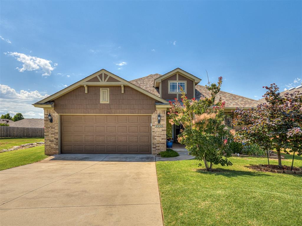This stunning Mountain Cottage style home sits right next to a greenspace and comes with a nice-sized covered porch and back patio overlooking a large fully fenced yard! Inside lies an open concept layout with lovely wood flooring, tile, and plantation shutters throughout the living space. The split plan allows distance between the primary suite and secondary beds/bath. The kitchen boasts stainless appliances with a smooth top cook range for easier cleanup, a breakfast bar, and large window for that added natural light! The living room offers a cozy gas fireplace with brick hearth and a cute built-in shelving unit next to it. The primary suite comes with double vanities, large walk-in closet, as well as a tile-surrounded soaking tub and stand-up shower! Extra perks of the home include an underground sprinkler system, in-ground storm shelter for peace of mind, newer roof, and new HVAC system! This house is a gem that won't take long to find its family, so let's hurry and make it yours! Greenleaf Trails is loaded with a splashpad, playground, walking trails, picnic areas, butterfly garden, and a stocked fishing pond!
