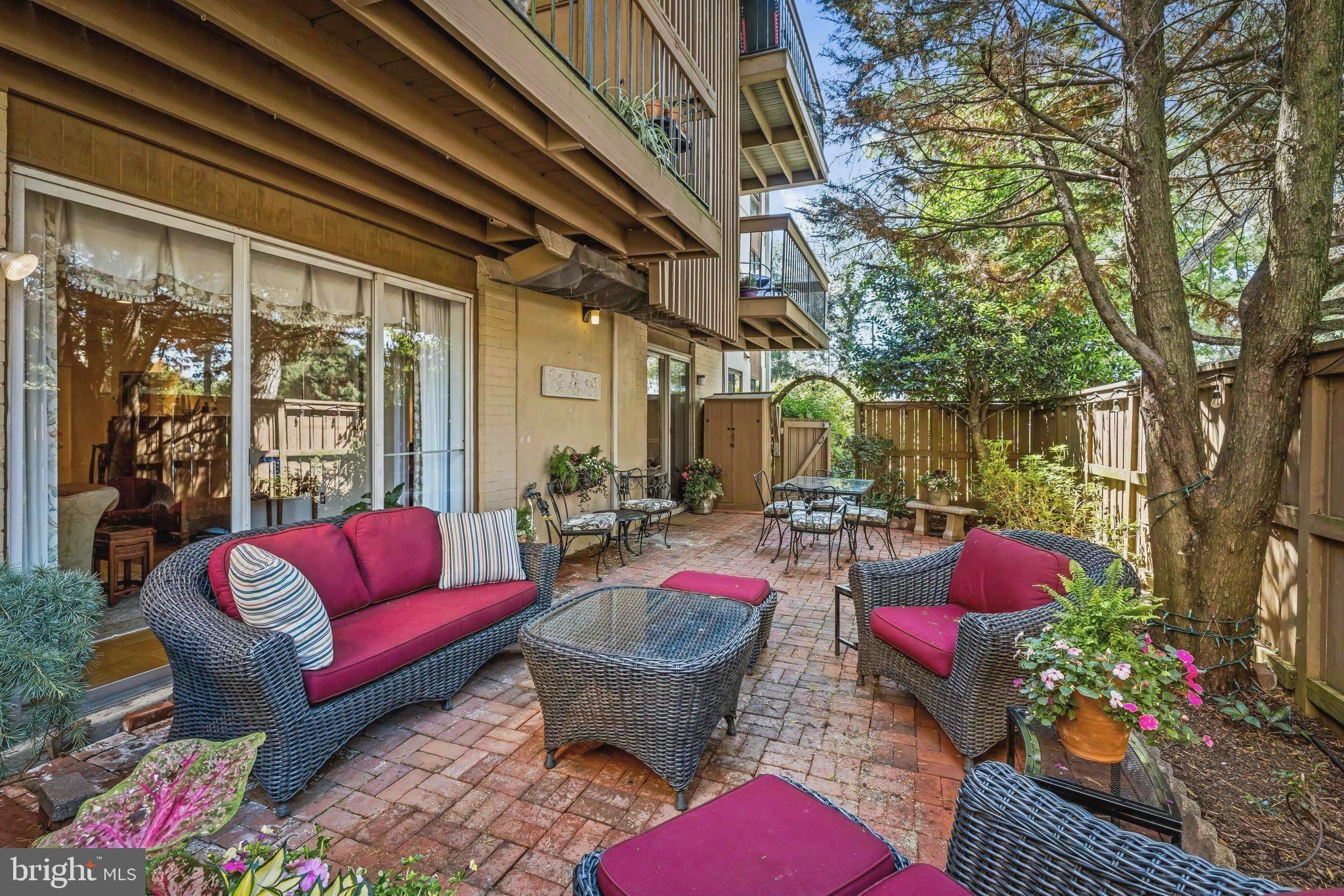 More than you could ever dream of in a condominium.  If you long for one level,  low maintenance living but you aren't ready to give up your outdoor space then this is for you. If you desire charming, spacious , multi-purpose rooms with custom built-ins, crown moldings and iconic wood parquet floors then this is for you. If you would enjoy a quiet location only moments away from exciting new restaurants, retail stores, specialty ice cream and pastry shops, cosmetics, eyeglasses, luxury linens, closet design...then this is definitely for you.The magic begins as you open your private gate to your fenced 35'x15' brick patio. The patio is bordered by planting beds containing multiple kinds of perennial flowers and greenery. Potted plants provide pops of vivid color.Inside the sliding glass doors you'll find a multi-purpose family room with custom built-ins and dining area.All floors, except baths and kitchen, are Cross Keys iconic wood parquet. A timeless white kitchen with gas cooking, suite of stainless appliances, abundant prep space and quartz countertops. The grand living room is spectacular with it's nod to gracious entertaining,  built-ins, moldings and glass doors overlooking the garden.The primary bedroom is all about serenity with it's soft colors, interior shutters and space to wind down from the day. En-suite primary bath features large shower with glass doors. Two more generous  size bedrooms are replete with their own baths. Stack washer/dryer conveniently located near bedrooms.This property offers uncompromised condo living.