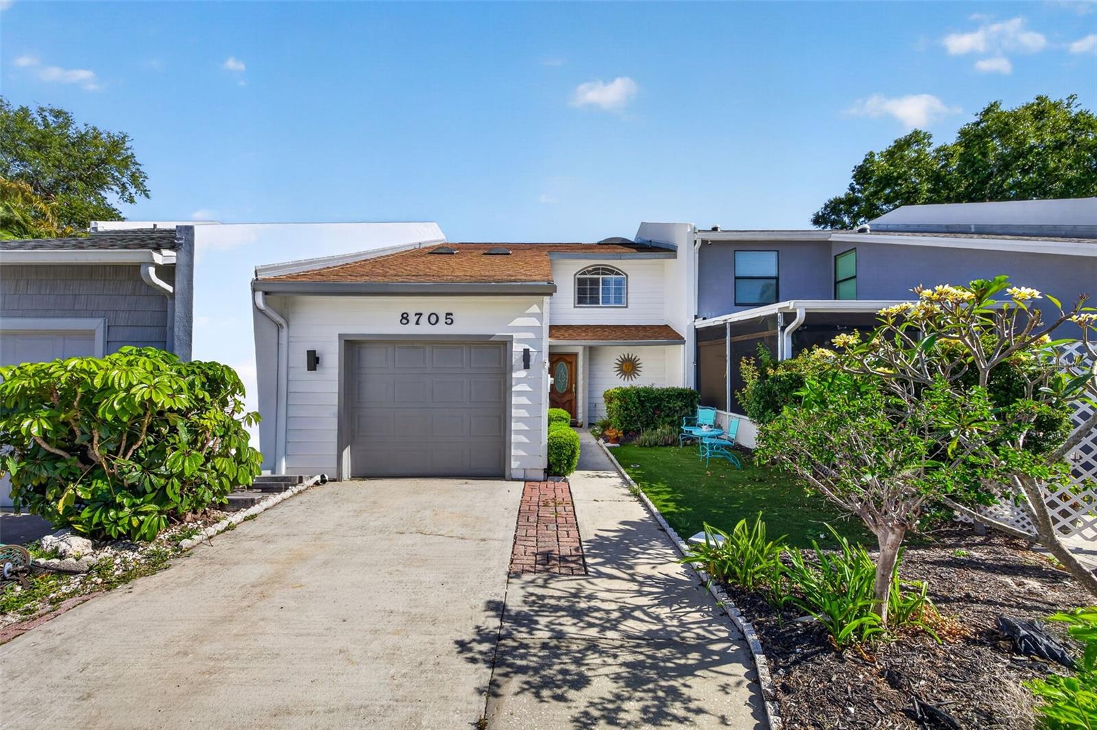 Adorable townhome in Bay Crest Park with NO condo or HOA fees and beautiful canal views! Enjoy the privacy of this move-in ready home offering 3 bedrooms (with potential for 4), 2.5 bathrooms, a garage, new HVAC and an extended lanai with plenty of room to entertain. This home would make a wonderful full-time residence, vacation home, or investment opportunity. As you enter, you’ll notice the continuous luxury vinyl flooring throughout the main living areas. The downstairs features an updated kitchen with new stainless-steel appliances, beautiful light fixtures, and views overlooking the great room, which opens to the screened lanai. There is also an additional family room perfect for entertaining, a dedicated dining area off the kitchen, and a convenient half bath for guests. Upstairs, you’ll find three spacious bedrooms plus a bonus room/large office off the primary suite that could easily serve as a fourth bedroom, nursery, or flex space. Sliding doors lead to a private screened area, perfect for morning coffee or evening cocktails. From there, step down to the newly paved extended lanai, offering ample space for outdoor dining, sunbathing, or taking in westerly sunset views down the canal. Enjoy this home year-round or take advantage of weekly rental opportunities for added income potential. Located in Bay Crest Park, a vibrant and highly desirable waterfront community, residents enjoy a fantastic location just minutes to Tampa International Airport, the VeteransExpressway, downtown Tampa, International Plaza, and some of the area’s beautiful Gulf beaches. Bay Crest is known for its boating lifestyle, community feel, and unbeatable convenience to shopping, dining, sporting venues, and everything Tampa Bay has. Residents also enjoy access to the community boat ramp, providing easy access for boating, kayaking, fishing and getting out on the water. Call today!
