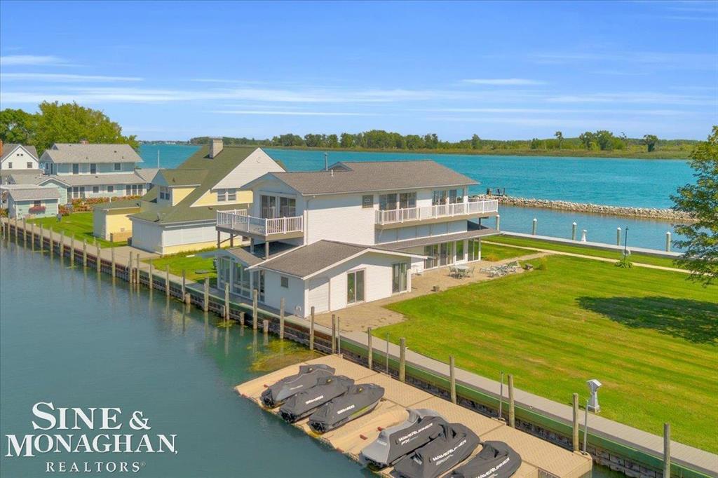 FOR THOSE WHO ARE LOOKING FOR RESORT-STYLE LIVING ON BEAUTIFUL HARSENS ISLAND, THIS 4-BEDROOM, 4-BATHROOM CUSTOM BUILT HOME IS PERFECTLY SITUATED ALONG THE SHORELINE OF THE SOUTH CHANNEL AND WITHIN THE GATES OF THE OLD CLUB, AN EXCLUSIVE PRIVATE ISLAND RESORT AND YACHT CLUB. THIS RIVERFRONT PROPERTY COMBINES COMFORT, ELEGANCE, AND THE ULTIMATE WATERFRONT LIFESTYLE. THE HOME WAS THOUGHTFULLY DESIGNED TO CAPTURE PANORAMIC WATER VIEWS FROM EVERY ROOM. THE SPACIOUS LAYOUT OFFERS THE PERFECT SETTING TO HOST FAMILY AND FRIENDS OR TO RELAX IN COMFORT AND SERENITY. ENJOY THE OUTDOOR LIVING SPACE FEATURING A BRICK PAVER PATIO AND 2 UPPER (TREX) DECKS PERFECT FOR SUNBATHING AND ENTERTAINING. FRONT AND BACK SUNROOMS FOR ADDED LIVING SPACE- THE PROTECTED HARBOR AND PRIVATE BOAT DOCKAGE ALLOWS EASY ACCESS TO LAKE ST CLAIR AND ALL THE SURROUNDING BAYS, A TRUE HAVEN FOR WATERCRAFT ENTHUSIASTS. ATTACHED GOLF CART GARAGE- DETACHED GARAGE SPACE WITH PARKING- DISCOVER ALL THE CHARM THE OLD CLUB HAS TO OFFER, INCLUDING A HEATED WATERFRONT POOL, FITNESS CENTER, TENNIS AND PICKLEBALL COURTS, GOLF COURSE, FINE DINING, MARINE SERVICES, AND A CALENDAR OF EVENTS FOR THE WHOLE FAMILY. LOCATED WITHIN AN HOUR OF METRO DETROIT AND A QUICK FERRY RIDE TO THE ISLAND.