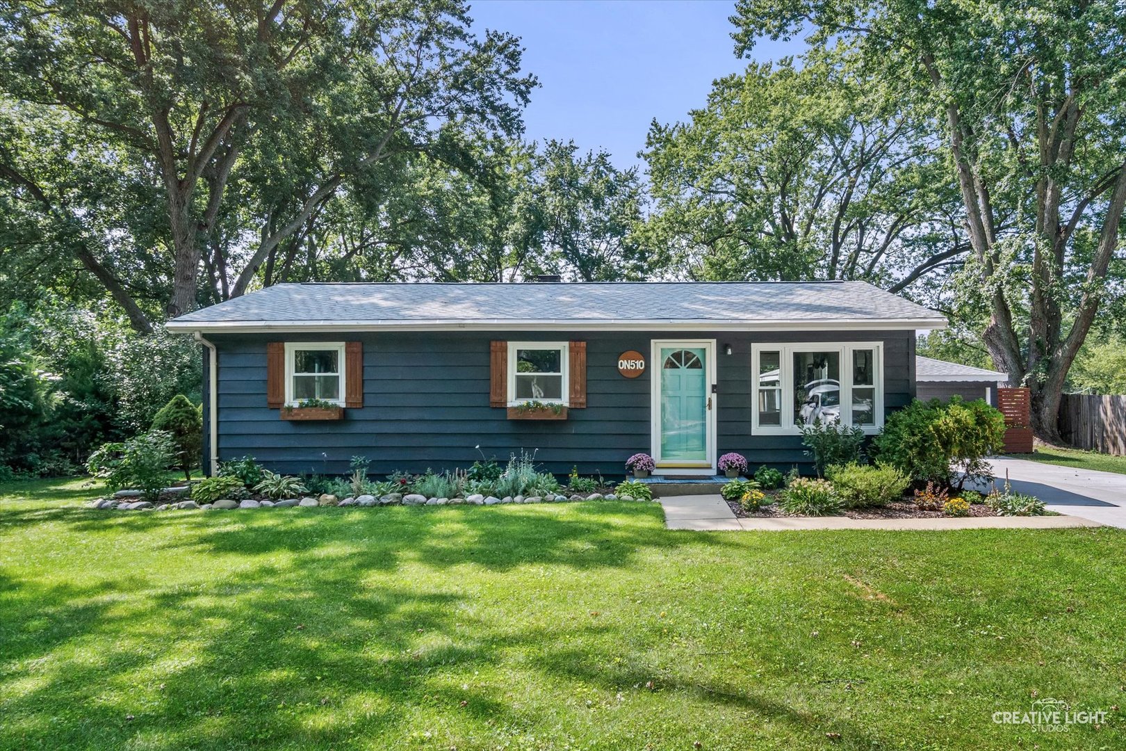 This updated and move-in ready ranch sits on almost half an acre and has so much to love. The updated fully equipped kitchen features white cabinets, black stainless steel appliances, granite countertops and a subway tile backsplash, all opening to a spacious floor plan that makes entertaining easy. The updated bathroom offers a relaxing soaking tub and tiled shower.  You'll also find three spacious bedrooms, gleaming hardwood floors, crown molding, an oversized two-car garage, a patio, large yard with a shed and beautifully landscaped gardens. So many big-ticket updates have been completed in recent years, including a new roof in 2026, water heater and washer/dryer in 2025, driveway and attic insulation in 2024, kitchen, bathroom and air conditioner in 2020, and furnace and windows in 2017. The location is hard to beat, with highly rated District 200 schools, shopping, dining and the Prairie Path nearby, plus easy access to Cosley Zoo, the Metra, highways and Downtown Wheaton. This one is ready to welcome you home!