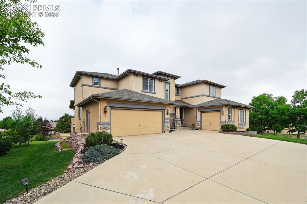 Stunning home on the 18th hole in the Pine Creek neighborhood with VIEWS GALORE! Walking up the steps you’re greeted by beautiful double entry doors that open to the expanse of the front foyer. Just off the foyer a semi-private sitting area, full bath, and office space create the perfect environment for the at home worker or can be utilized as another bedroom as needed. Continuing into the living area the gas fireplace, vaulted ceilings, and picturesque windows make the space feel grande. Just as you enter the living area a formal dining room sets the stage for entertaining guests. The living area seamlessly flows into the eat in and walk out kitchen. The kitchen features a barstool height center island, stainless steel appliances, gas range, and ample counter and cabinet space. The dining space walks out to the gorgeous back deck with breathtaking views. The upper level features three spacious bedrooms including the opulent master oasis. Entering the master a seating area with fireplace is private to the bedroom. The ensuite bath has a large garden tub, free standing shower, separate double vanity areas, and his and her walk in closets. Bedrooms two and three with a shared full bath are just across the balcony walkway that peers down into the living area. Downstairs the basement level is well lit with walk-out access to the back patio with hot tub and beautiful fully fenced back and side yard. The family room has a barstool height wet bar, gas fireplace, and pool table. Bedrooms four and five with a shared full bath, and storage area finish out the basement area. This home has it all with two garages for three cars and in a prime location whether your interest is the Pine Creek Golf Club, all the shops and restaurants Briargate Parkway has to offer, or the ease of access to I25 and the Air Force Academy.