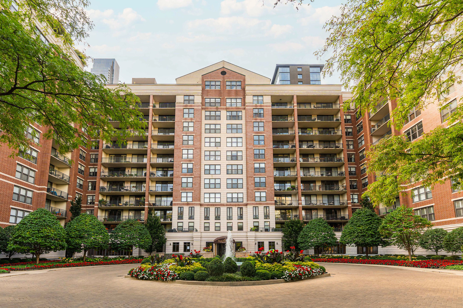 Step inside this beautifully updated 3,100+ sq. ft. Park Newberry condo with year-round views of Washington Square Park and the Newberry Library. The condo's gracious entry, with a walk-in closet and renovated powder room,  leads to the spacious open main living area with 9' ceilings. An electric fireplace subtly separates the living and dining areas, with three sets of sliding doors opening to the 39' balcony.  Adjacent to the living room is the office while the dining room connects to the breakfast area leading into the kitchen. The updated kitchen has new quartz countertops, backsplash, plumbing fixtures, hardware, and stainless-steel appliances, including a new double oven, refrigerator, microwave and wine fridge. Abundant storage and a second entrance with direct elevator access add convenience. The split floor plan provides a fabulous primary suite, created by combining the original fourth bedroom into a spacious retreat with sitting area, electric fireplace and two walk-in closets. A renovated spa bath features a wet room with a European tub and shower, plus double vanity, rivals the best hotels. The library/bedroom, second bedroom, and renovated 2nd bath complete this space offering flexibility. Other recent updates include 3 new air handlers, lighting fixtures and in-unit washer/dryer. The building has undergone extensive upgrades, including a refreshed lobby and hallways, a renovated amenity floor with gym, party room, and business center, and modernization of all five elevators. A deeded main-level garage space (#P230)  with an adjacent storage room is included, with an adjacent second space (#P231) and additional storage available for purchase ($40,000). The building is pet-friendly (two dogs up to 25 lbs. each) and offers 24-hour door staff, on-site management, and round-the-clock maintenance.