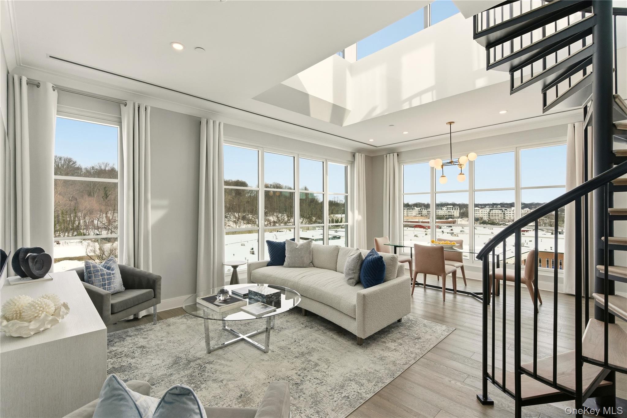One of the last remaining Penthouses at The Beacon! This sun-lit two-bedroom, two-bathroom residence features 10' ceilings and floor to ceiling windows. This spacious layout features an open kitchen, a balcony off the primary bedroom and an almost 900 SF private rooftop terrace. The gourmet kitchen complete with custom paneled GE appliances has white Brazilian quartzite countertops and a kitchen island with a Kohler under-mount sink, Insinkerator garbage disposal and instant filtered hot and cold water faucet. A GE Monogram 6 burner gas range is equipped with dual infrared cooking and is fully vented. The white Siena flat paneled cabinets and a Sharp 'easy touch' drawer style microwave complete the space. The gracious primary bedroom features an en-suite 4-fixture primary bathroom with white marble floors, countertops and full height porcelain tiled walls, shower and a double vanity with all Kohler fixtures. The fully equipped laundry room includes front loading washer and dryer. The Beacon at Garvies Point is perfectly situated in North Shore's most dynamic new community, set in a 56-acre picturesque waterfront and adjacent to a 62-acre serene nature preserve. The Beacon is comprised of 167 one, two and three bedroom condominium residences within 1 hour of Manhattan. Exclusive residential services & amenities feature a 24-hour concierge, outdoor kitchens, outdoor pool, state-of-the-art fitness center, yoga studio, library, lounge, card room, game room, dining/party room with prep kitchen and a 32 occupant screening room. Garvies Point development is a Smart Growth, mixed-use community located along the shores of Hempstead Harbor in Glen Cove, Long Island. The development provides generous expanses of high quality open space for residents and visitors to enjoy.