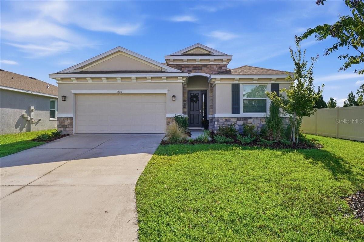 Welcome to your dream home in the heart of North Park Isle, Plant City! This meticulously maintained 4-bedroom, 2 and Half-bathroom gem offers the perfect blend of modern comforts and timeless charm. Boasting a spacious 2-car garage and situated in this truly wonderful community, this residence is a genuine Florida haven. Step inside and be greeted by an open-concept living space, featuring abundant natural light and stylish finishes throughout. The well-appointed kitchen is a chef's delight, complete with granite countertops, stainless steel appliances, and ample cabinet space. Whether you're entertaining guests or enjoying a quiet evening in, this home provides the perfect backdrop for making lasting memories. The master suite is a true retreat, offering a sanctuary of relaxation with its generous proportions and an ensuite bathroom that includes dual vanities and a luxurious soaking tub. Two additional bedrooms provide flexibility for guests, a home office, or a growing family. Step outside to discover your own private oasis. The backyard is an ideal space for outdoor gatherings, barbecues, or simply unwinding after a long day. Plus, enjoy the perks of the vibrant North Park Isle community, including a clubhouse, pool, playground, pickle ball courts, and basketball court, located next door! North Park Isle's amazing community amenities and proximity to local parks and schools make this location very central. Conveniently located near the interstate, shopping, medical, restaurants and much more this home provides easy access to everything Plant City has to offer while offering a tranquil escape from the hustle and bustle. Don't miss the opportunity to make this house your home – schedule a showing today and start envisioning your future in North Park Isle!
