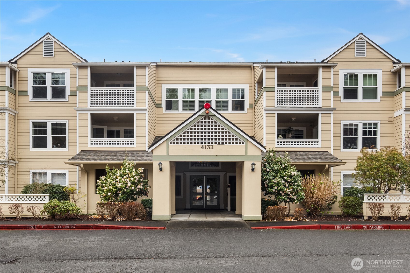 Welcome to Washington Village, a highly sought-after 55+ community in the heart of Issaquah Highlands. This light-filled, move-in ready condo offers a spacious and functional floor plan designed for comfort and ease. Enjoy an open living and dining area with large windows that bring in abundant natural light, creating an inviting space for relaxing or entertaining. The well-appointed kitchen offers ample cabinetry and prep space, flowing seamlessly into the main gathering areas. The generous primary suite features a private bath and excellent closet space, while the second bedroom and additional bath provide flexibility for guests, hobbies, or a home office. A private covered balcony extends your space outdoors, perfect for morning coffee or quiet evenings. In-unit laundry, dedicated parking, and secure building access add everyday convenience, while a gated entry and in-unit fire sprinklers provide peace of mind. Residents enjoy access to a well-equipped clubhouse featuring an indoor pool and hot tub, fitness center, community room, and outdoor patio. Beautiful nearby walking trails and a weekly community bus to the grocery store enhance ease of living. Ideally located near shopping, dining, parks, and medical services, with quick access to I-90. Comfortable, connected, and carefree living awaits.