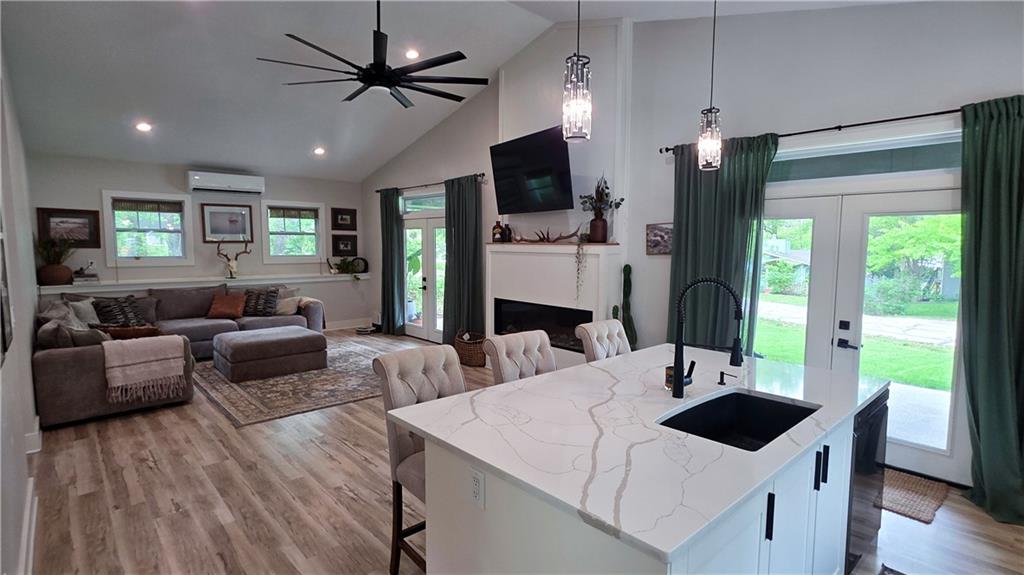 Love Lake Lotawana but don't love the renovations and maintenance that can come with an older lake home? Built in 2022, this second-tier home offers something that's hard to find at the lake: newer construction just steps from the water.Step inside this move-in ready home and enjoy the features that matter: radiant heated floors, quartz countertops, an electric fireplace, and a bright open-concept layout designed for everyday living and entertaining alike. The spacious kitchen and living area create the perfect setting for hosting friends after a day on the lake or simply enjoying a quiet evening at home.The primary suite offers a true retreat with a walk-in closet and spacious en suite bath designed for comfort and convenience.Outside, you’ll find room to spread out with a generous yard ideal for kids, pets, yard games, or summer gatherings.Even better? A dock lease is secured through September 2026 giving you added lake access and more opportunity to enjoy everything Lake Lotawana has to offer. Properties this close to the lake with newer construction, added flexibility, and room to grow don’t come around often. Schedule your private showing today and experience Lake Lotawana living for yourself.