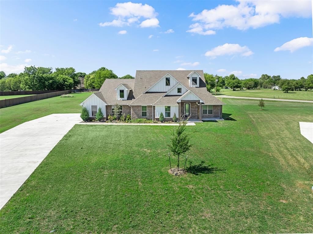 Welcome to Brentwood—a highly desired gated addition. Nestled on an extra large and spacious 1.09-acre corner lot, this home is truly magazine-worthy from every angle. It gives you that peaceful out-of-town feel while keeping you close to I-35, OU, and Riverwind Casino.Walking in, you're greeted by an incredible living room featuring a vaulted cathedral ceiling and a cozy fireplace. You'll immediately notice the beautiful real hardwood floors—sealed and durable. This major upgrade flows right into the kitchen.Your new kitchen is a striking high-contrast black and white balance. It’s set up perfectly for daily life or entertaining. Kitchen features an upgraded oversized farmhouse sink, a walk-in pantry, and the very convenient double ovens.The master bath is a true retreat with two separated vanities, a huge walk-in shower, and a deep water freestanding tub. From there, step into the master closet of your dreams. It was thoughtfully custom-designed to maximize space with a perfect combo of built-in shelves, mirrors, and rods. Even better, it connects directly to the large utility room with ample folding space—an unbelievably convenient layout that makes laundry an absolute breeze.Enjoy the fresh air from either your covered front porch or the covered back patio overlooking a massive yard. With a Wi-Fi sprinkler system, security setup, and garage openers included, all the hard work is done and this home is completely move-in ready for its new owners. Schedule a showing today and welcome to your dream home.Call today and ask about builder incentives up to $10,000.