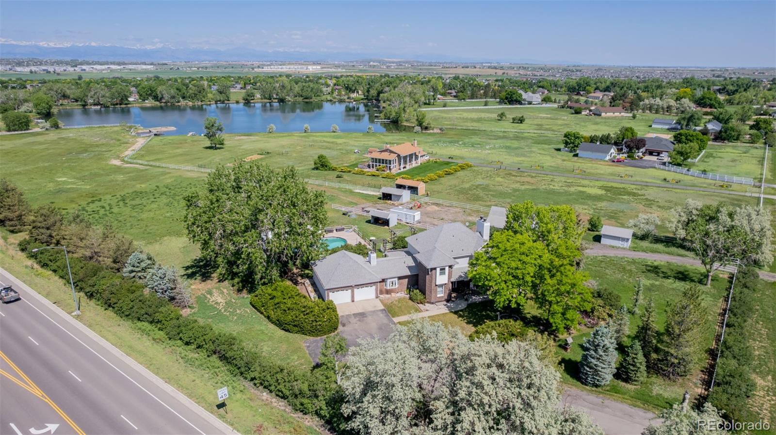 Discover this magnificent corner estate set on a sprawling 6.9-acre lot with breathtaking mountain views and direct lake access!
From the moment you arrive, you’ll be impressed by the timeless brick façade, inviting wraparound porch, two-car garage, and beautifully landscaped grounds that frame this exceptional property. Inside, generous living spaces are designed for both comfort and elegance: The great room features a cozy stone fireplace, warm wood-look flooring, and recessed lighting. A separate family room with plush carpet and a second fireplace creates the perfect spot for relaxed evenings. The kitchen is a chef’s delight with abundant cabinetry, a stylish tile backsplash, built-in appliances, pantry, and a peninsula with breakfast bar. The tranquil owner’s suite is a true retreat, complete with a private sitting area and a spa-like bath featuring dual sinks. The finished basement adds incredible flexibility—offering a bonus room with another fireplace, an additional bedroom, a utility room, and a laundry area.
Step outside to enjoy a spacious patio overlooking the backyard oasis, including a sparkling swimming pool perfect for summer days. Equestrian enthusiasts will appreciate the stall, barn, shed, and ample open space for further improvements. Best of all, you’ll enjoy direct lake access with a private dock and cozy fire pit—the perfect setting for unforgettable evenings under the stars.
This property truly has it all—space, amenities, and views. Don’t miss your chance to experience this gem today!