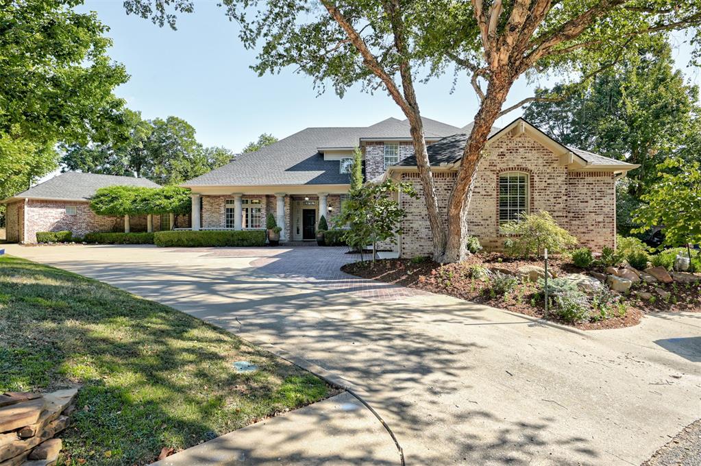 Beautifully remodeled home tucked away on a quiet cul-de-sac in one of Norman’s most convenient campus-area locations. Offering more than 4,600 square feet of living space on nearly half an acre, this impressive property blends classic character with extensive modern updates, generous living spaces, and a private backyard setting just minutes from the University of Oklahoma.The interior has been thoughtfully remodeled with a fresh, light-filled design while retaining the warmth and character of the home. The updated kitchen is a standout, featuring crisp cabinetry, an oversized contrasting island, expansive new countertops, stainless appliances, updated lighting, and abundant storage. Rich hardwood floors, fresh neutral finishes, plantation shutters, extensive built-ins, and updated fixtures carry throughout the main living areas. Multiple living and entertaining spaces provide tremendous flexibility, including a spacious great room with fireplace, formal dining area, private study, and upstairs game/flex room. The remodeled primary suite offers a true retreat, highlighted by a dramatically updated bathroom with a freestanding soaking tub, large glass-enclosed shower, updated vanities, contemporary fixtures, and a bright spa-like atmosphere. Extensive built-in cabinetry and storage add both function and character throughout the bedroom wing.Outside, enjoy your own private retreat with a swimming pool, pool bath, covered outdoor living space, fenced lawn, dog run, and direct access to the adjoining greenbelt and 1.5 mile walking trail. The setting offers an unusual combination of privacy, mature surroundings, and convenient access to central Norman and OU.Additional features include four spacious bedrooms, private and adjacent baths for all bedrooms, a large laundry room, three-car side-entry garage, storm shelter, and extensive storage. *reserved items- dining room and study ceiling lights*