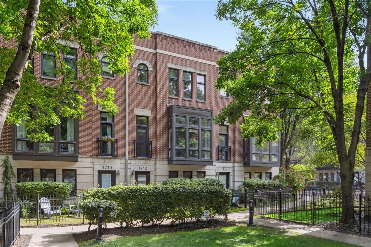 Welcome to this beautifully updated tri-level townhome plus roof deck, located in the sought-after Columbia Townhome Association in the Lakeview community and Burley School District. The main floor features a spacious, modern kitchen with an oversized dining area, perfect for entertaining, alongside a bright living room that overlooks the courtyard and boasts a cozy wood-burning fireplace. The ground level offers a convenient mudroom and a versatile bonus space ideal for a home office or fourth bedroom, all with direct access to the attached two-car garage. Upstairs, you'll find three generously sized bedrooms and two full bathrooms, including a comfortable primary suite. Top it all off with a private rooftop deck on the fourth level, offering ample space for lounging, grilling, or entertaining guests.