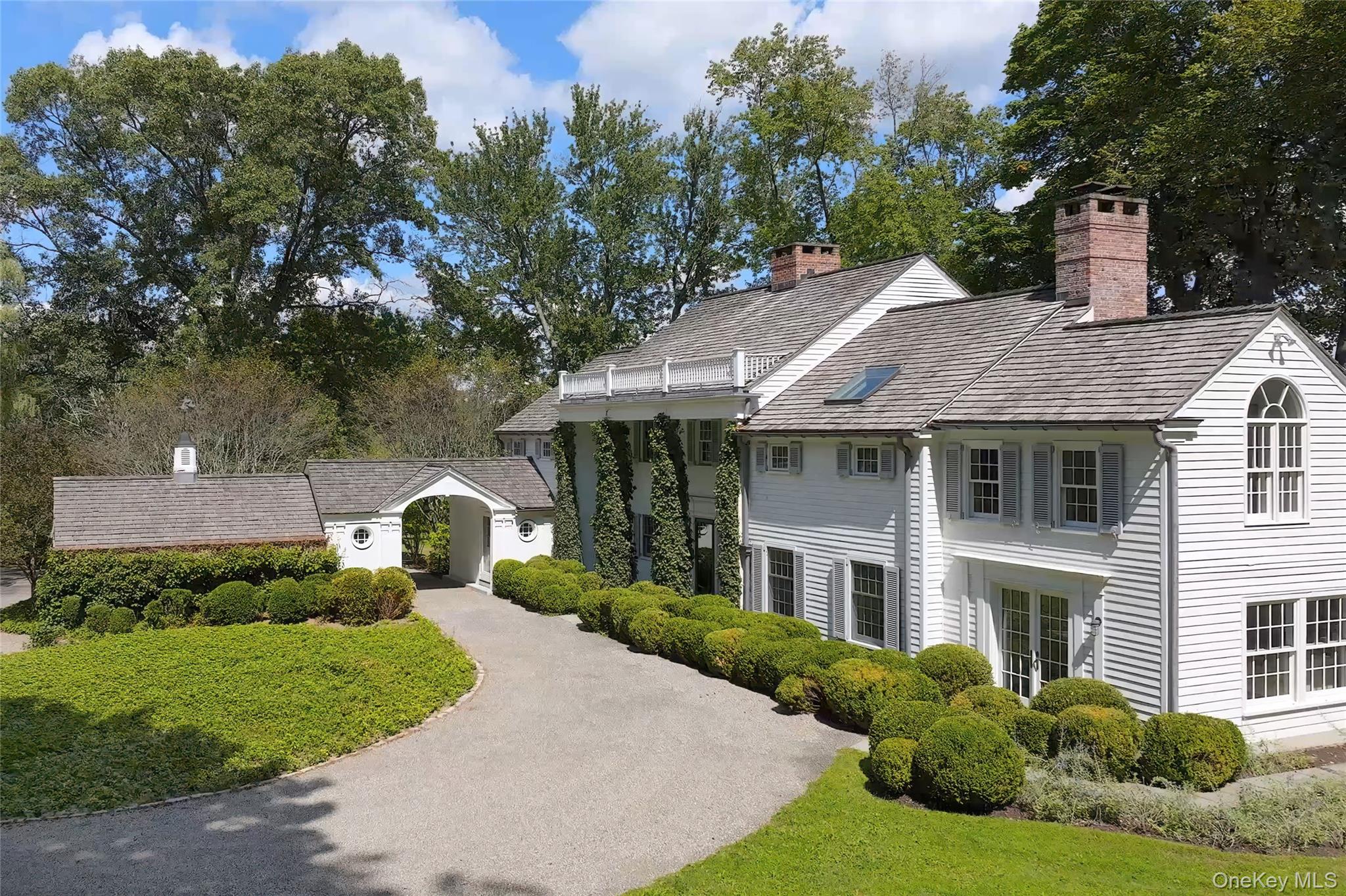 Introducing an extraordinary Bedford estate on almost 12 acres of vast fields with spell-binding Northeastern views spanning over 50+ miles. Renovated and owned by Ian Schrager, known for reimagining the Modern Lifestyle through his unique vision as a hotelier and real estate developer.  This is his family’s retreat- less than an hour to Manhattan- ideal for those seeking an exceptionally curated and relaxing lifestyle. Large open fields for horses, orchards or a farm, the property is situated amid the 100 mile network of the Bedford riding and hiking trails- minutes to the bucolic village of Bedford, an historic village with an active Playhouse, restaurants, several interesting stores and a town green where there are occasional town events.
Built in 1936 and renovated in 2014, the timeless exterior architecture of brick and clapboard has been renovated with chic transitional interiors and a seamless use of natural textures and muted tones all while preserving  original detailing throughout the home.  A beautifully renovated eat-in kitchen opens to a flagstone patio where one can entertain while taking in the distant views. Mature trees offer shade and dot the landscape along with the vintage stone walls. Five  bedrooms and four and one half baths, three fireplaces, a spacious primary suite and a media room are just some of the special features which include a a secluded pool and cabana and playhouse on the hillside. 
A rare offering in a special location!