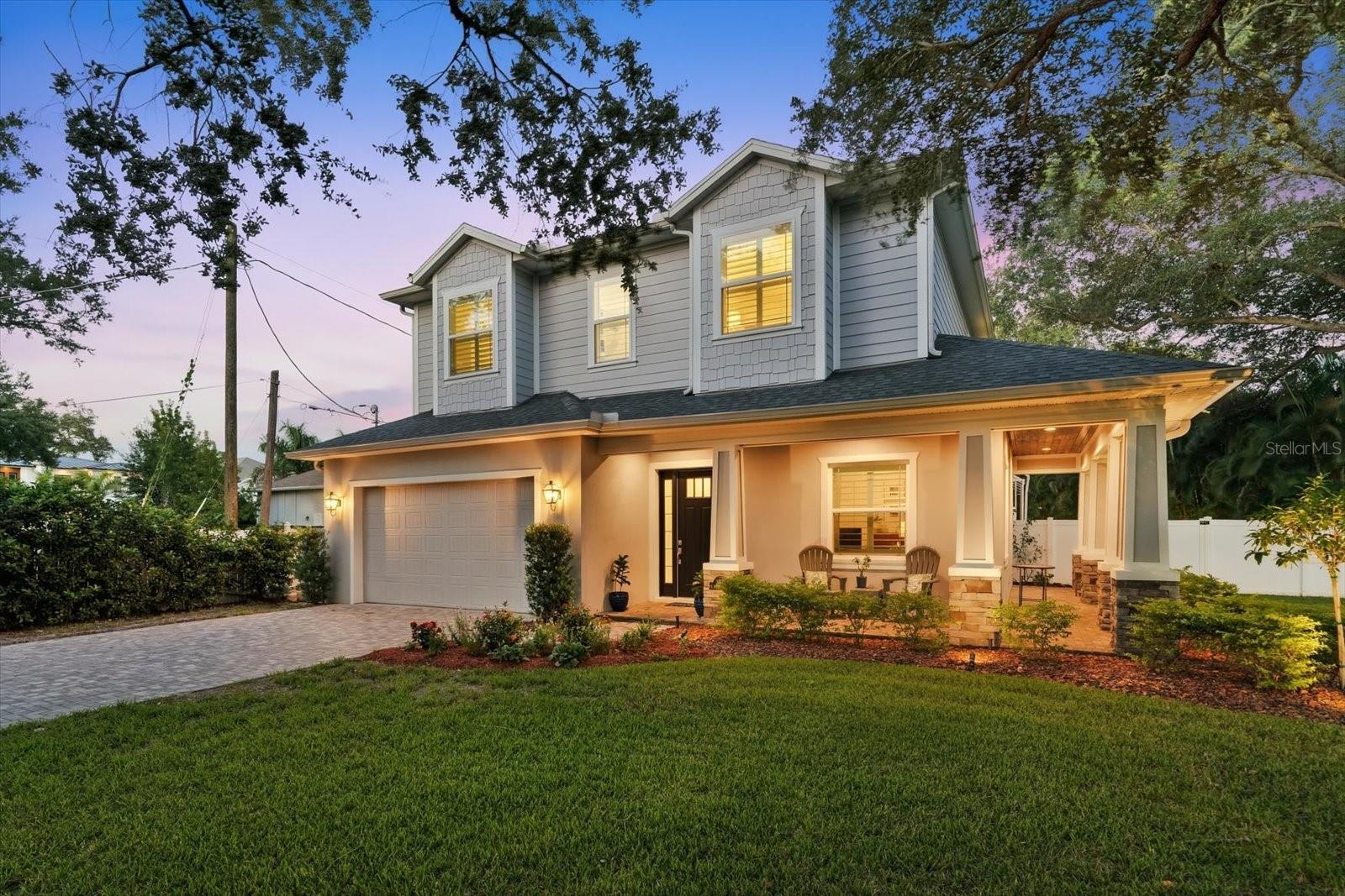 South Tampa’s best-kept secret is ready to be discovered. Tucked away in a peaceful neighborhood near Bayshore Boulevard, 3608 E Sterling Circle offers five bedrooms, four full baths, and exceptional outdoor living on an oversized lot. Built in 2020 and located outside a designated flood zone, this home features a freshly painted interior, making it ready for you to move right in. A wraparound covered front porch welcomes you inside, where a first-floor bedroom and full bath offer flexibility for guests or a home office. The open layout connects the living and dining spaces with a kitchen featuring a large center island, floor-to-ceiling cabinetry, stainless steel appliances, and a natural gas range. A mudroom area with additional custom cabinetry keeps everyday essentials organized, while the spacious two-car garage includes a designated tool area.Large sliding doors open to an expansive screened enclosure with a saltwater pool and spa, extended paver decking, and plenty of space for outdoor dining and lounging. Beyond the pool, a generous turf yard and privacy from surrounding neighbors create a secluded setting for relaxing, entertaining, or enjoying the Florida sunshine. Upstairs, four bedrooms surround a second sitting area—ideal for a TV room, playroom, or quiet retreat. The primary suite features a bath with dual sinks and a shower with numerous shower heads. An additional bedroom with a private en suite bath and two secondary bedrooms connected by a Jack-and-Jill bath complete the thoughtful layout. From mornings on the front porch to evenings by the pool, this home offers comfort, privacy, and convenience in the heart of South Tampa, within walking distance of Roosevelt Elementary. Schedule your private showing and discover the secret for yourself.