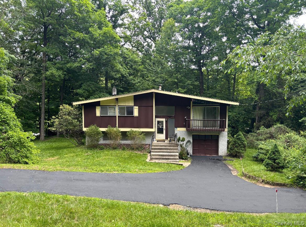 NOW Easy to Show  Welcome to this beautifully maintained raised ranch offering the perfect blend of space, comfort, and convenience in a highly desirable Chappaqua P.O. location within the award-winning Pleasantville School District. Situated on a quiet cul-de-sac, this 4-bedroom, 2-bath home features soaring cathedral ceilings, rich red oak hardwood floors, and an inviting open layout designed for both everyday living and entertaining.The spacious living room provides the ideal setting for gatherings and holidays, while multiple freshly stained multi-level decks create seamless indoor-outdoor living perfect for entertaining, summer barbecues, or relaxing evenings overlooking the expansive park-like property. The large yard offers endless possibilities for play, gardening, and recreation, plus three storage sheds for added convenience. Also included is a 11'x54' triangular shaped lot on north side of primary lot. .46 Acre TotalRecent updates including a newer roof and boiler provide peace of mind, while the attached garage adds practicality and storage. Commuters will love the easy 5-minute walk to the Chappaqua train station with approximately 45-minute access to Grand Central Terminal. Rarely offered, this home also includes FREE school bus pickup within Pleasantville’s walking district.Ideally located just minutes from the farmers market, shops, restaurants, parks, and Metro-North, this move-in ready home delivers comfort, charm, and an exceptional lifestyle in one of Westchester’s most sought-after communities. Easy to show same day showings are ok now.