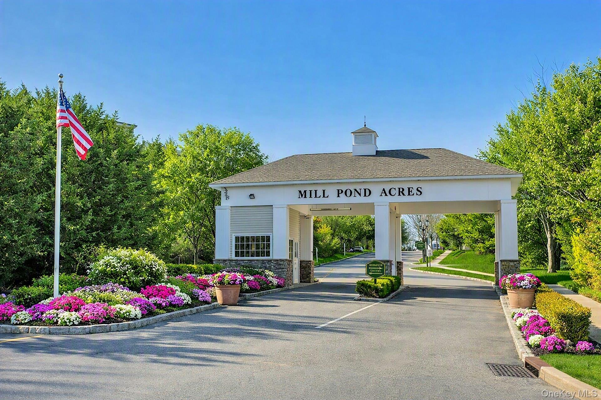 Port Washington Mill Pond Acres - Welcome home to your luxury, 55+, 24 hour security, gated community. Spacious 2 bedroom, 2 bath condo with balcony. Convenient chair lift for people or packages. Light, bright and inviting. Vaulted ceilings, extra space for office or reading room. Updated kitchen with granite and breakfast bar. High hats, professionally outfitted closets, hardwood flooring, crystal chandelier, new hot water heater, gas heat and cooking. Washer/dryer and storage closets. Newly updated clubhouse with indoor pool, card rooms, lounge, entertaining area, kitchen, gym, sauna, hot tub. Tennis/pickleball courts, gazebo, fountains, walking paths. Must be seen to love.
