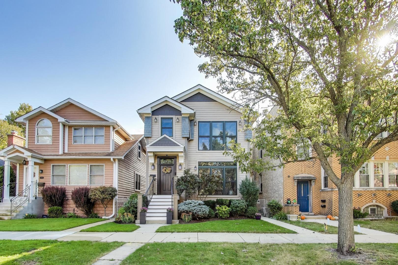 Experience the perfect blend of luxury and convenience in this stunning Norwood Park home. Built in 2012 and thoughtfully maintained and updated, every detail is designed to elevate your everyday living. Step inside and immediately feel the openness with an extra-wide layout flooded with natural light, soaring ceilings on every level, and rich architectural details like curved arches, statement cutouts, and a grand staircase that anchors the main floor. The living room's oversized windows frame the tree-lined street and flow seamlessly into the chef's kitchen, a true showstopper featuring Viking Professional stainless steel appliances, new Bosch dishwasher, granite countertops, and a generous island with seating perfect for gatherings. A deck just off the kitchen invites effortless indoor-outdoor entertaining with space for grilling, dining, or simply enjoying the spacious yard. Upstairs, the luxury primary suite feels like a retreat with tray ceilings, a custom walk-in closet, and a spa-like ensuite offering a dual-sink vanity, jetted tub, and walk-in shower. Two additional bedrooms are bright and airy, sharing an updated hall bath with another dual-sink vanity and walk-in shower. Convenience continues with second floor laundry featuring an LG washer and dryer. The lower level is designed for entertaining, featuring radiant flooring throughout, impressive 9' ceilings, a wet bar with wine and beverage fridges, and a custom entertainment system with surround sound, a 120" projection screen, and AV rack ($15,000 upgrade). An additional room with ensuite is ideal for guests, home gym, play room or office. Outside, enjoy the extra wide lot with a 2.5-car garage, low-maintenance turf yard, and professional landscaping, as well as the unparalleled longevity of a slate roof. More updates include a newer composite front porch (2021), portico (2018), and numerous updates throughout, including a NEW NTI boiler (2016), and upgraded mechanicals for peace of mind. Perfectly situated near the Blue Line and Metra access, I-90/I-94, top-rated Taft High School, parks, restaurants and shopping, this home offers both luxury and lifestyle in one incredible package. Welcome home!