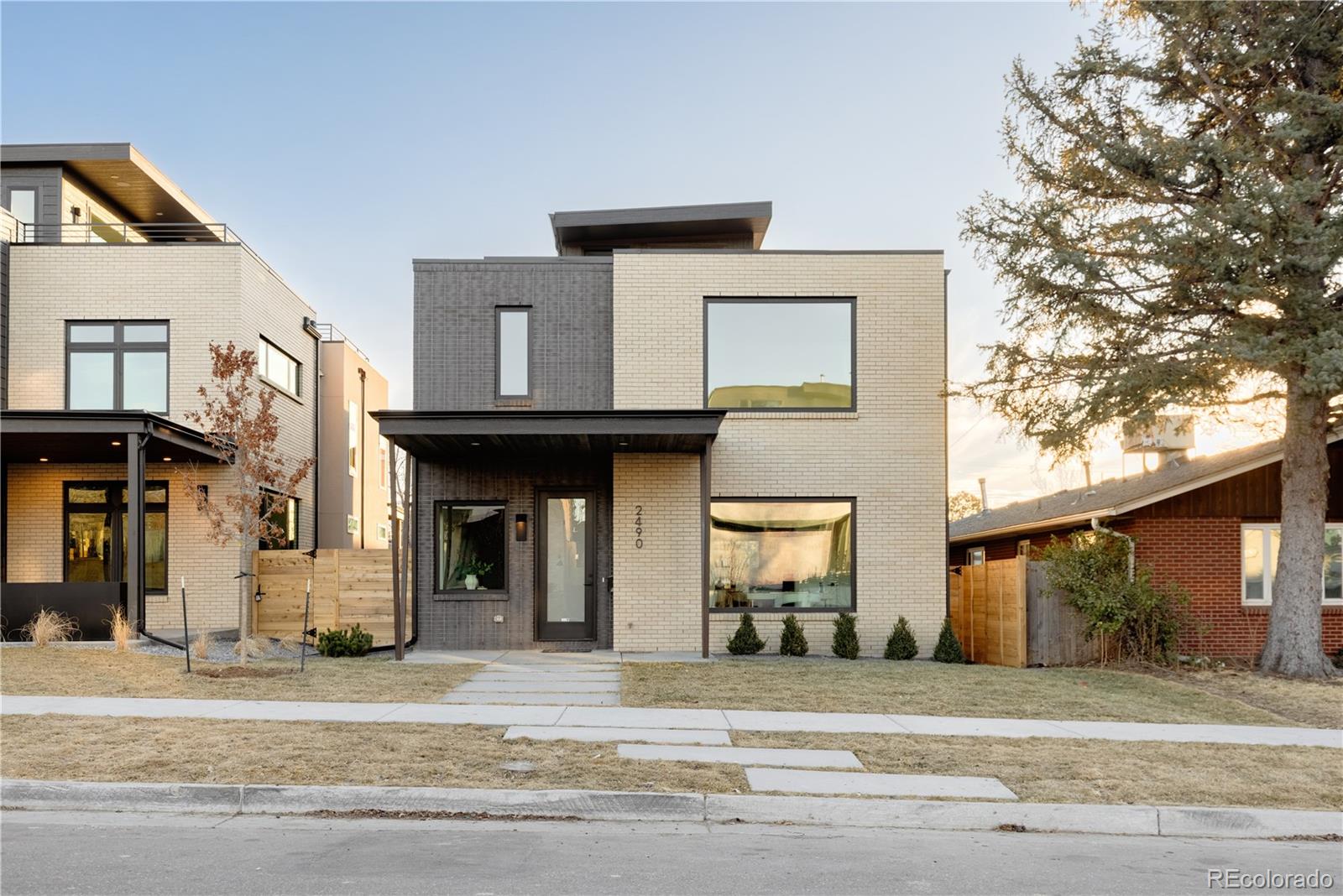 Perfectly positioned just steps from the shimmering shores of Sloan’s Lake, this stunning custom home by coveted Workshop builder is a masterclass in modern design and effortless living. Framed by floor-to-ceiling windows, the home is bathed in natural light, capturing breathtaking lake and mountain views from multiple vantage points.  Architectural detail aboutnds with signature elements of Work Shop Colorado - distinctive design selections, built ins, custom metal work and detailing.  Thoughtfully designed for both everyday living and elevated entertaining, the open-concept layout is anchored by exceptional custom built-ins and seamless indoor-outdoor flow. Retreat to the rooftop level—an inspiring flex space ideal for a home office, studio, or lounge—where panoramic vistas create the ultimate backdrop for work or play.The primary suite is a true sanctuary, featuring a spa-caliber bath with a lavish wet room with European soaking tub, and expansive walk-in closets that rival custom boutiques. Three additional bedrooms offer generous accommodations for family or guests.An oversized garage with sleek epoxy flooring adds both function and polish, while the home’s premier location places you moments from Sloan’s Lake Park—Denver’s second-largest park and a beloved destination for its scenic trails, recreation, and vibrant community energy . Enjoy effortless access to neighborhood dining, boutique shopping, and the best of lakefront living in one of Denver’s most dynamic and sought-after enclaves.Suited with a eurpean style "lift" by the current owners, no step taking is  needed to connect the first and second stories.  A treat for some, and not necessary for others, the sellers will remove to original space if desired for the new owners. This is more than a home—it’s a lifestyle defined by design, location, and the rhythm of the lake.
