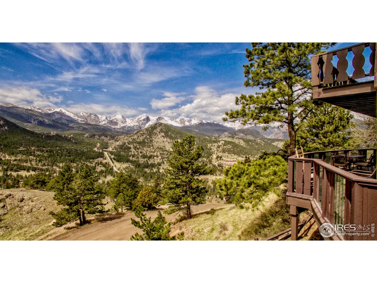 Incredible Panoramic Mountain Views of RMNP and The Continental Divide. Upper unit licensed STR provides comfort, luxury and Income Flexibility. Perched high on the slopes of Ram's Horn Mountain in the coveted private residential luxury home community of Windcliff Estates, this upper residence offers approximately 1,908 square feet of elevated mountain living with sweeping panoramic views of the Continental Divide. Positioned within a stand-alone over/under duplex condo, this home delivers privacy, dramatic vistas, and exceptional flexibility for full-time living, second-home use, or continued short-term rental operation.The upper level features a classic wood-burning fireplace anchoring the main living area, reinforcing the timeless mountain character that defines this home. Expansive west-facing windows and outdoor living space showcase ever-changing alpine light, sunsets, and views across Rocky Mountain National Park. The layout is generous and functional, designed for both everyday comfort and entertaining. Short-term rentals are codified by HOA rules and Larimer County zoning, and this unit is a very successful rental. Buyers may continue rental use, enjoy personal mountain living, or blend both strategies.Additional Opportunity:The lower residence in this duplex is also available for purchase. When acquired together, the two units function as a combined 6-bedroom vacation rental that legally sleeps up to 16 guests, offering a rare large-format rental opportunity in the Estes Valley.Whether purchased independently or paired with the lower unit, this property offers outstanding views, proven rental appeal, and long-term value in one of the area's most scenic mountain settings.