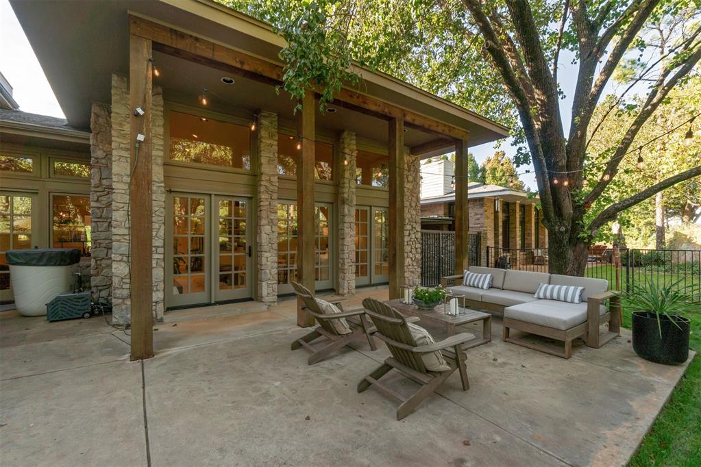 This charming patio home is exquisitely set along the 10th tee box of Oak Tree National Golf Course. The refined residence offers 2 bedrooms, 2.5 baths, soaring ceilings and timeless travertine floors. The amazing use of space and openness provides a fresh feel and appeal for hosting. Expansive windows frame stunning patio views leading to the 10th hole with open-concept living areas with natural light. Enjoy a private patio overlooking one of Oklahomas finest courses including the upcoming PGA Senior Open in 2027! The monthly dues are for exterior maintenance, access to community amenities such as clubhouse, pool and tennis courts.