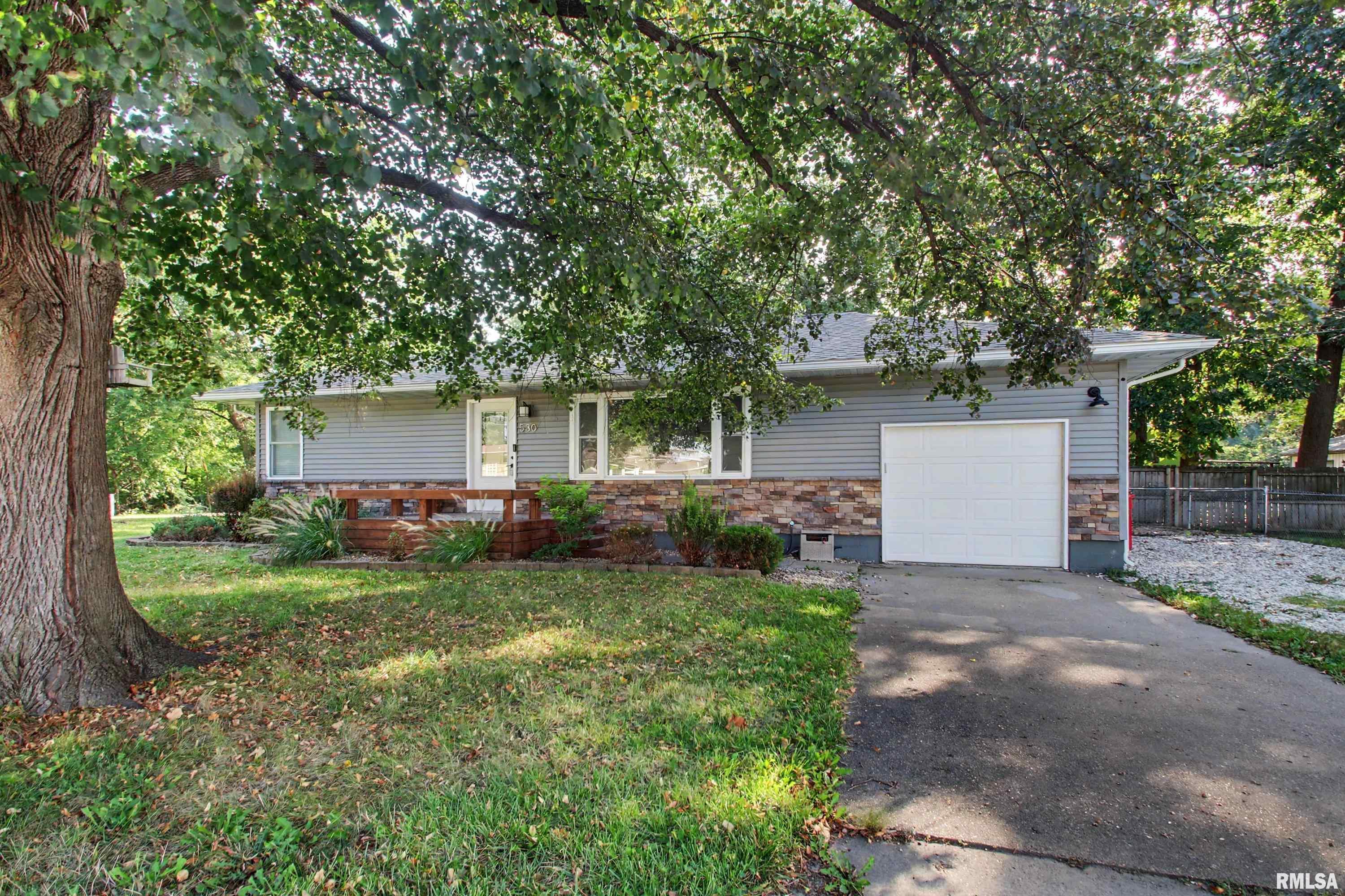 This beautiful move in ready ranch home is situated on a large half acre lot in a desirable location on the edge of town. With many updates the last several years all that is left is to move in. Freshly painted kitchen cabinets along with updated countertops and flooring are all part of the charm of this home. Everything is on one level with no basement to worry about and a large covered deck in the back allows you to enjoy the outdoors with shade and protection from the elements. An attached garage means no more scraping snow and ice off your vehicle in the winter or getting soaked running from your car to the house during a rainstorm. There is additional parking next to the driveway and at the edge of the property so there is plenty of parking space for visitors. The large fenced in yard offers countless possibilities for pets or outdoor entertainment. The roof was replaced in 2022 and the large front window was replaced in 2023. Insulation was added to the attic and crawl space in 2022. The septic was pumped this year.  The extra half bath in the laundry room is a wonderful bonus as well.  This home offers easy access to shopping and restaurants but is outside of city limits.  Call to schedule your showing today!