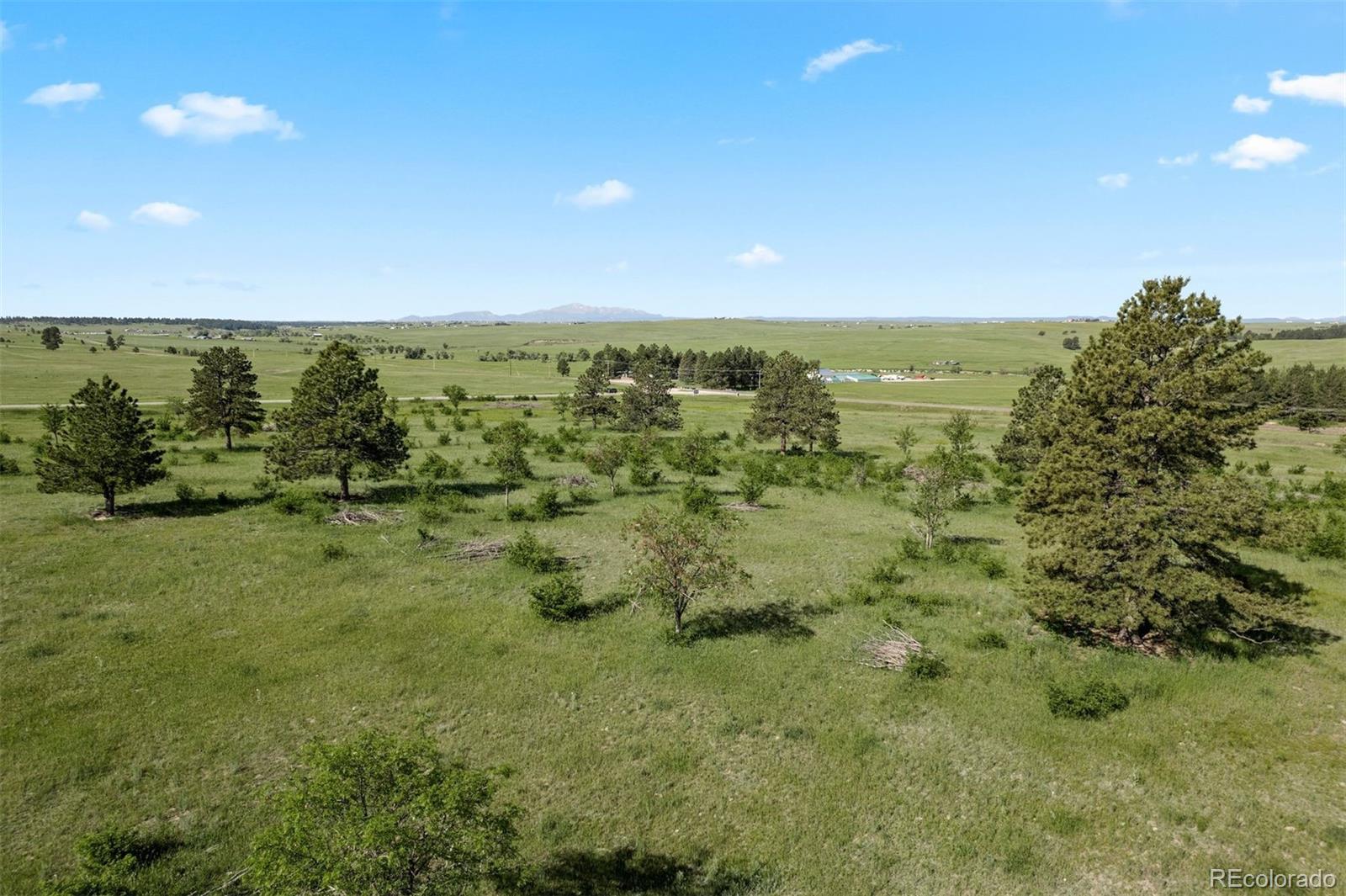 Big views, big sky, and big possibilities — this is where country living meets wide-open freedom. With sweeping views of Pikes Peak and the Front Range, the open landscape offers endless potential, whether you’re dreaming of a custom home, an equestrian setup, or a place to spread out and soak in the fresh air. Fully fenced and situated on a prime corner lot, it provides both space and accessibility. The land offers flexibility for horses, outbuildings, or whatever suits your lifestyle. Just five minutes from the town of Elizabeth, with groceries, dinning, shopping, and cafes, you get the best of both worlds—county living plus small-town charm and easy access to Denver, Parker, Castle Rock, and Colorado Springs. This is land is for those who want space, views, and a taste of the good life. CORE is the electrical provider for the area. They have a helpful estimator tool on their website. Seller does not know who is responsible for building the cul-de-sac, buyer to verify.