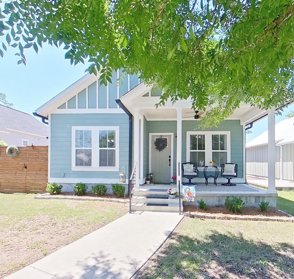 Welcome home to this charming cottage-style retreat in the sought after Victoria Park community, just a short stroll from the heart of the bricks of downtown Thomasville! Built only four years ago, this beautifully maintained home offers the perfect blend of modern convenience and timeless Southern charm. Relax on the inviting rocking chair front porch overlooking the greenspace of Victoria Park or unwind in the side screened porch while enjoying peaceful evenings at home.  Inside, the thoughtfully designed open-concept floor plan creates a bright and welcoming atmosphere, seamlessly connecting the kitchen, dining, and living areas -- ideal for both entertaining and everyday living. This spacious three-bedroom, two-bath home features quality craftsmanship throughout, along with practical upgrades that make daily life easy and comfortable. The custom-built 8'X10'X10' wired outbuilding perfectly matches the home's exterior and provides excellent additional storage or workshop space.  A privacy-fenced area on either side of the screened porch offer flexibility for pets, gardening, or outdoor enjoyment. Additional highlights of the property include a four-car concrete parking pad, gutters, extra floored attic storage, window blinds throughout, and an exterior-vented kitchen exhaust fan.  Enjoy the convenience of being within walking distance to downtown dining, shopping, and entertainment while still enjoying the comfort of a quiet neighborhood setting. This move-in ready cottage offers the best of Thomasville living with style, comfort, and location all in one package. Call to make your appointment to visit this one-of-a-kind property today or have a look thru the Virtual I-Guide Tour here: https://unbranded.youriguide.com/207_armster_ln_thomasville_ga/