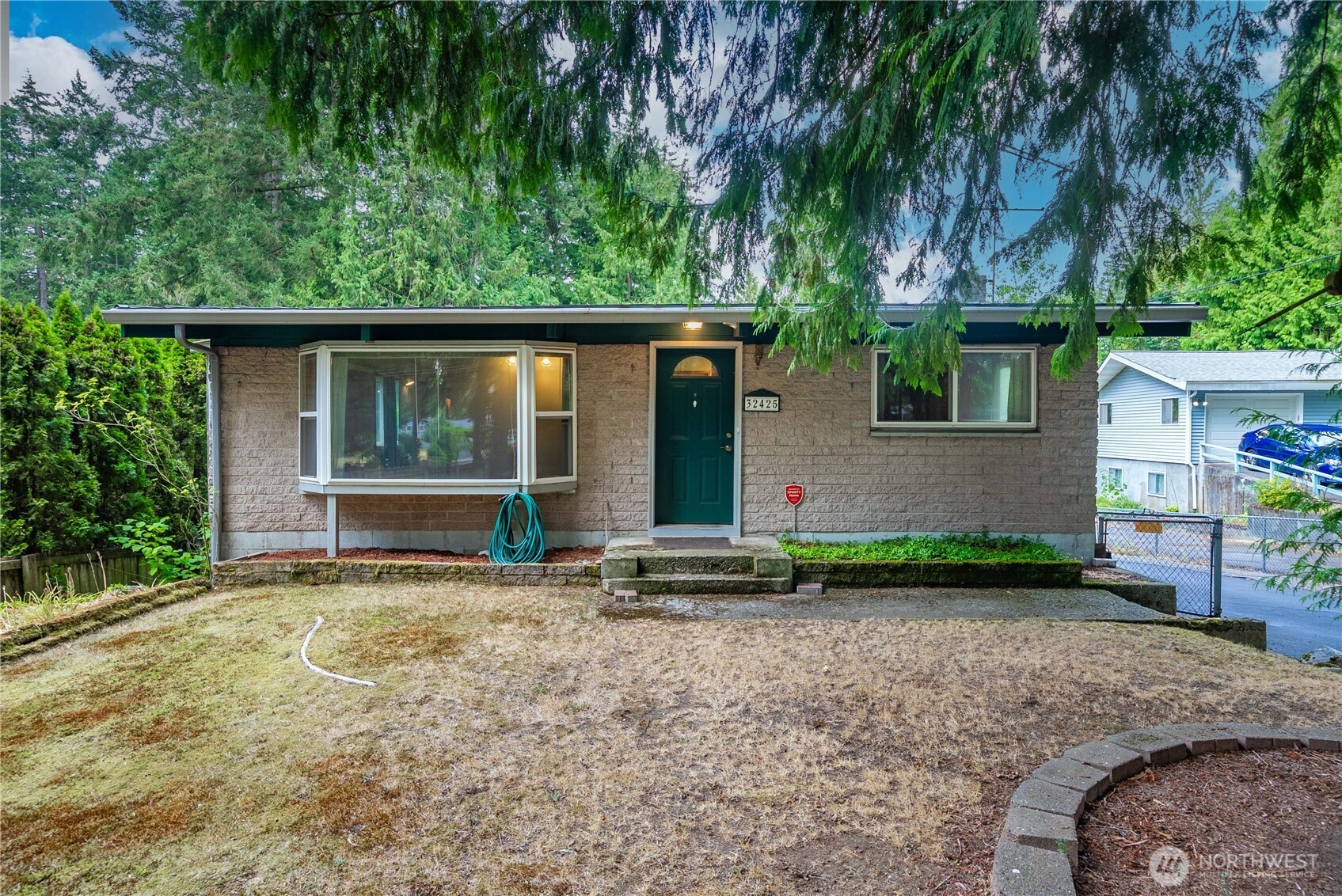 Investor alert! Under 350K in King County! Bring your tool belt and make this home your own with a little imagination and sweat equity. This home checks all the boxes with its convenient location, minutes to I-5 off 320th, Large lot, .34 acres, and newer large metal framed detached 1200 sq. ft. garage/shop with large oversized garage doors. Look into the possibilities of separating the lot into two parcels, multiple units, or just an expanded re-model.  With new sewer upgraded down 46th, plan on connecting to the stub out on city sewer and making building multiple units easy.
