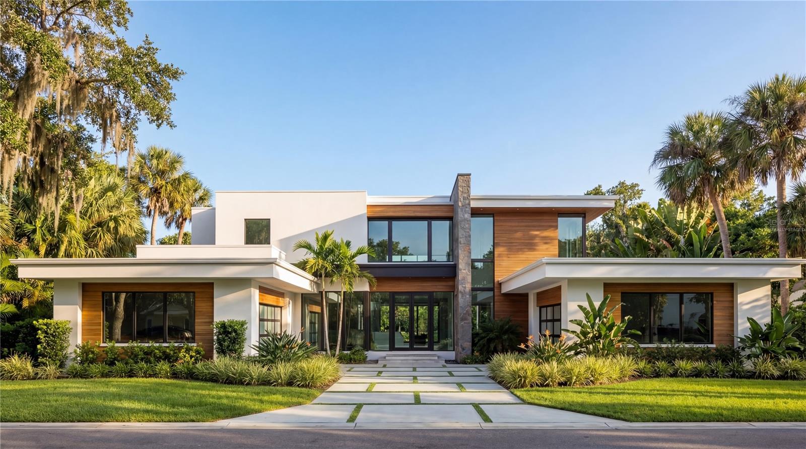 Virtually Staged. Under Construction. Being expertly built by Mrcela Custom Homes, this modern estate presents a rare opportunity to own a legacy property along the front nine of Lake Nona Golf & Country Club's Championship golf course. Elevated on its corner home site, this work of art will showcase timeless architectural vision, refined luxury, and exceptional craftsmanship. Spanning more than 6,000 square feet of living space, the design includes a grand primary suite with spa-style bath, multiple en-suite bedrooms, a private theater and a sophisticated home office. Expansive indoor-outdoor living areas with floor-to-ceiling glass walls, a designer kitchen with scullery, and imported finishes throughout, create a residence that blends elegance, functionality, and lifestyle excellence. Perfectly situated for golf course views and sunset skies, the spacious exterior living area includes a modern pool, spa and summer kitchen. Offering superb amenities, exceptional family experiences and outstanding service, Lake Nona Golf & Country Club has delivered the highest quality of living in Central Florida for more than 30 years. Additional estate features include two, 2-Car Garages. One garage, fully airconditioned, offers flex space for a fully equipped fitness studio and golf simulator.