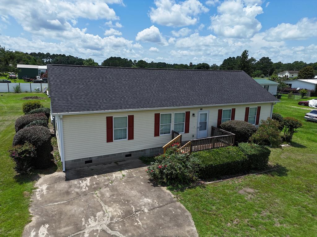 Check out this charming and spacious 4-bedroom, 2-bath family home! Located on half an acre in the Temple Terrace neighborhood, between Thomasville and Cairo. Outside, you can relax under a large covered recreational space. The yard has fencing for privacy and outdoor fun. Inside, you'll find a cozy split floor plan with fresh paint and durable vinyl floors throughout. The owner's bedroom features a spacious bathroom with a double vanity and a soaking tub for relaxation. The kitchen has the original cabinets with the sink overlooking the backyard. It's a warm, inviting place that's perfect for creating great memories. Click here for virtual tour: https://my.matterport.com/show/?m=ZcmFZCSBMAv&mls=1