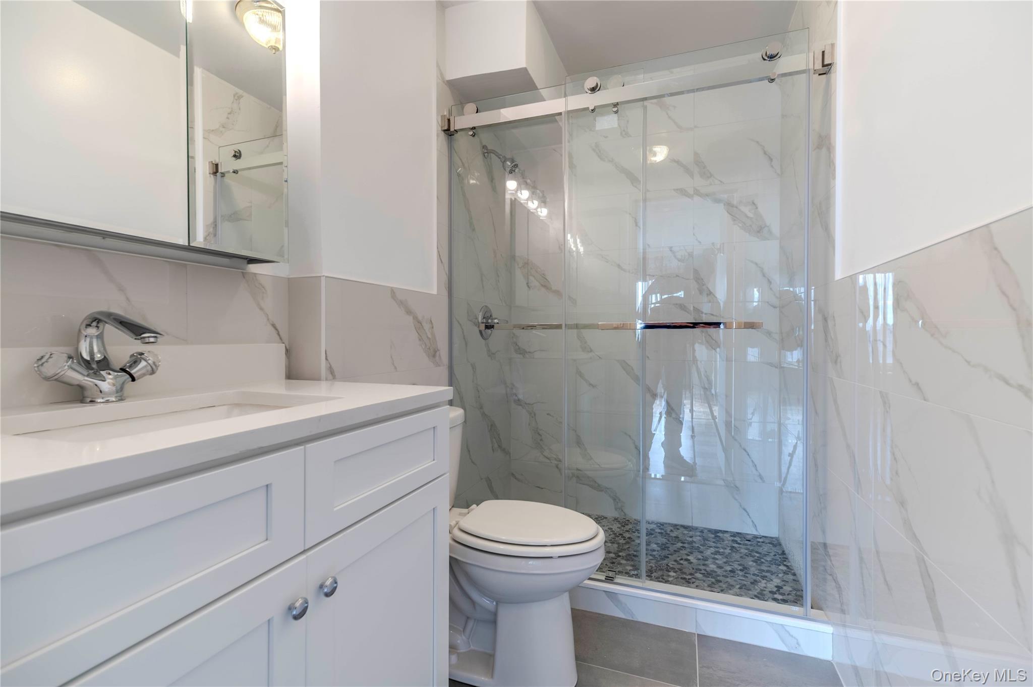 Experience luxury waterfront living at the Cryder House, Beechhurst’s premier 24-hour doorman cooperative. This beautifully updated 2-bedroom, 2-bath residence offers a bright, open layout with the bedrooms located on opposite sides of the apartment, providing wonderful privacy and flow. The spacious living and dining area features parquet hardwood floors (just refinished) and oversized windows that fill the home with natural light. The modern kitchen is equipped with granite countertops, stainless steel appliances, and custom cabinetry—perfect for everyday living or entertaining. Both bathrooms have been completely renovated with elegant tilework, sleek vanities, and contemporary fixtures, creating a fresh, spa-like feel. The primary suite offers a renovated full bath and a walk-in closet, while the second bedroom on the opposite side of the apartment is equally spacious. A convenient laundry room is located right outside the apartment door, and a free basement storage bin is included with the unit. Enjoy your private balcony with partial water views and take advantage of exceptional amenities including a heated Olympic-size pool (no extra fee), gym, library, community room, basketball court, playground, picnic areas, and six acres of landscaped waterfront grounds. Parking includes a deeded indoor valet space ($147/mo) and outdoor parking available ($110/mo). Located near the QM2 express bus to Manhattan and Q15 to Flushing, this private, secure community also offers Beechhurst Beach rights. Maintenance is $2,270/month plus electric and parking, with a temporary assessment currently in place. Motivated seller—voted Best Co-op in Beechhurst!"