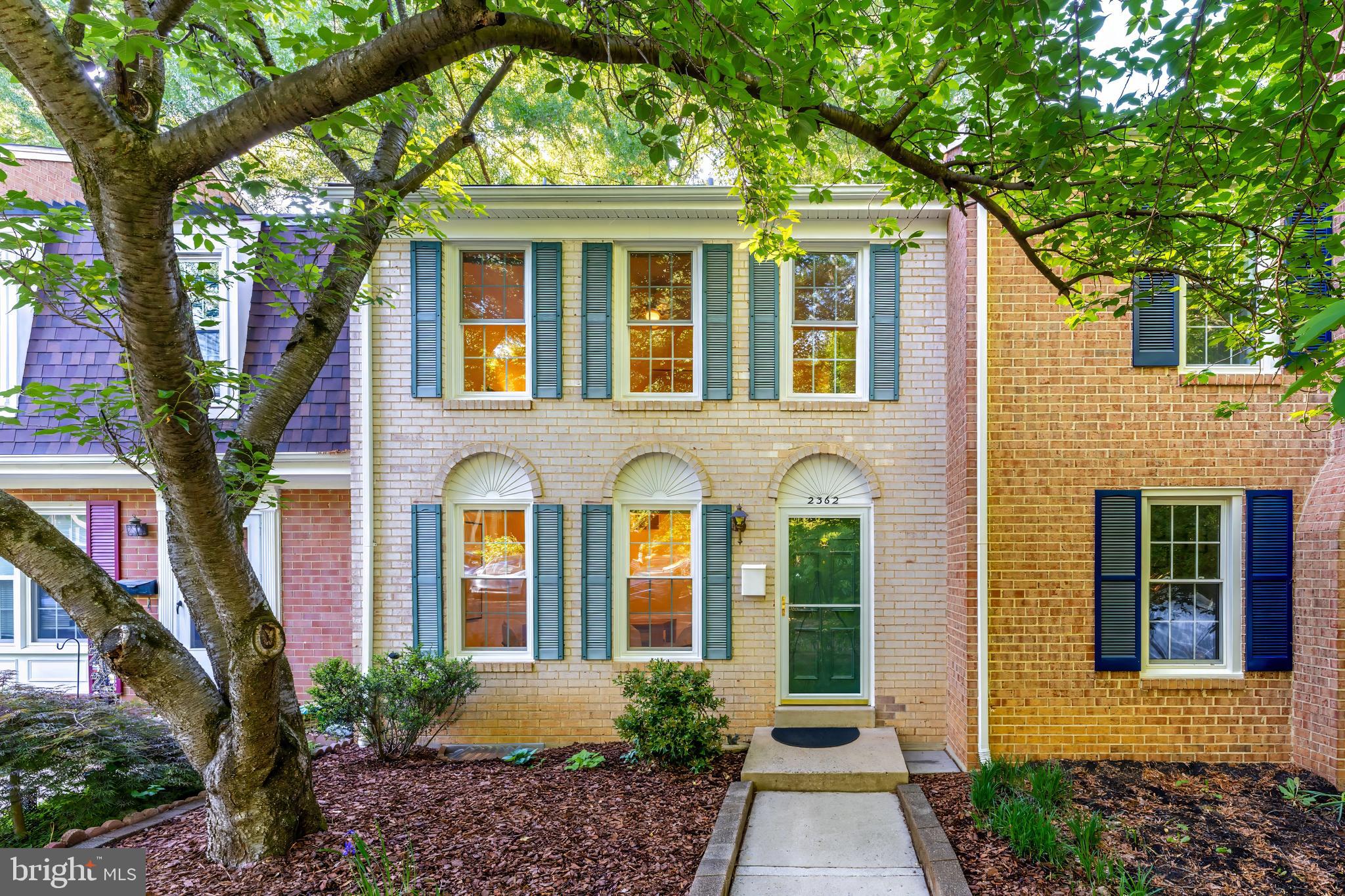 Tucked away on a quiet non-through street in Deepwood, this all-brick townhome offers a layout and setting that make everyday living feel easy. Hardwood floors run throughout the main and upper levels, while the main floor flows naturally from room to room, creating a comfortable space for both entertaining and daily life. The updated kitchen features warm natural wood cabinetry, granite countertops, and stainless steel appliances, opening seamlessly to the surrounding living and dining spaces. Upstairs, you’ll find three bedrooms and two well-maintained full baths, while the walkout lower level brings in an impressive amount of natural light and offers a huge rec room, recessed lighting throughout, and finished storage space that is both practical and flexible. Step outside to a large brick paver patio that easily accommodates gatherings, all surrounded by a fully fenced yard that offers privacy and room to unwind. The home also includes one assigned parking space along with abundant overflow parking. Major updates include a 25-year roof and windows installed in 2014, HVAC replaced in 2022, and water heater in 2019. Deepwood is a vibrant community with its own private pool, tennis courts, playgrounds, trails, and neighborhood events, with the added benefit of not being part of the Reston Association, though owners may choose to join RA if desired. Located within the Hunters Woods, Langston Hughes, and South Lakes school pyramid, the home is moments from Hunters Woods Shopping Center with Safeway, Starbucks, Dunkin’, restaurants, retail, Reston Community Center, Walker Nature Center, nearby Fairfax Connector bus stops, and convenient access to Reston Parkway, Fairfax County Parkway, the Dulles Toll Road, Reston Town Center, Silver Line Metro stations, and Dulles International Airport.