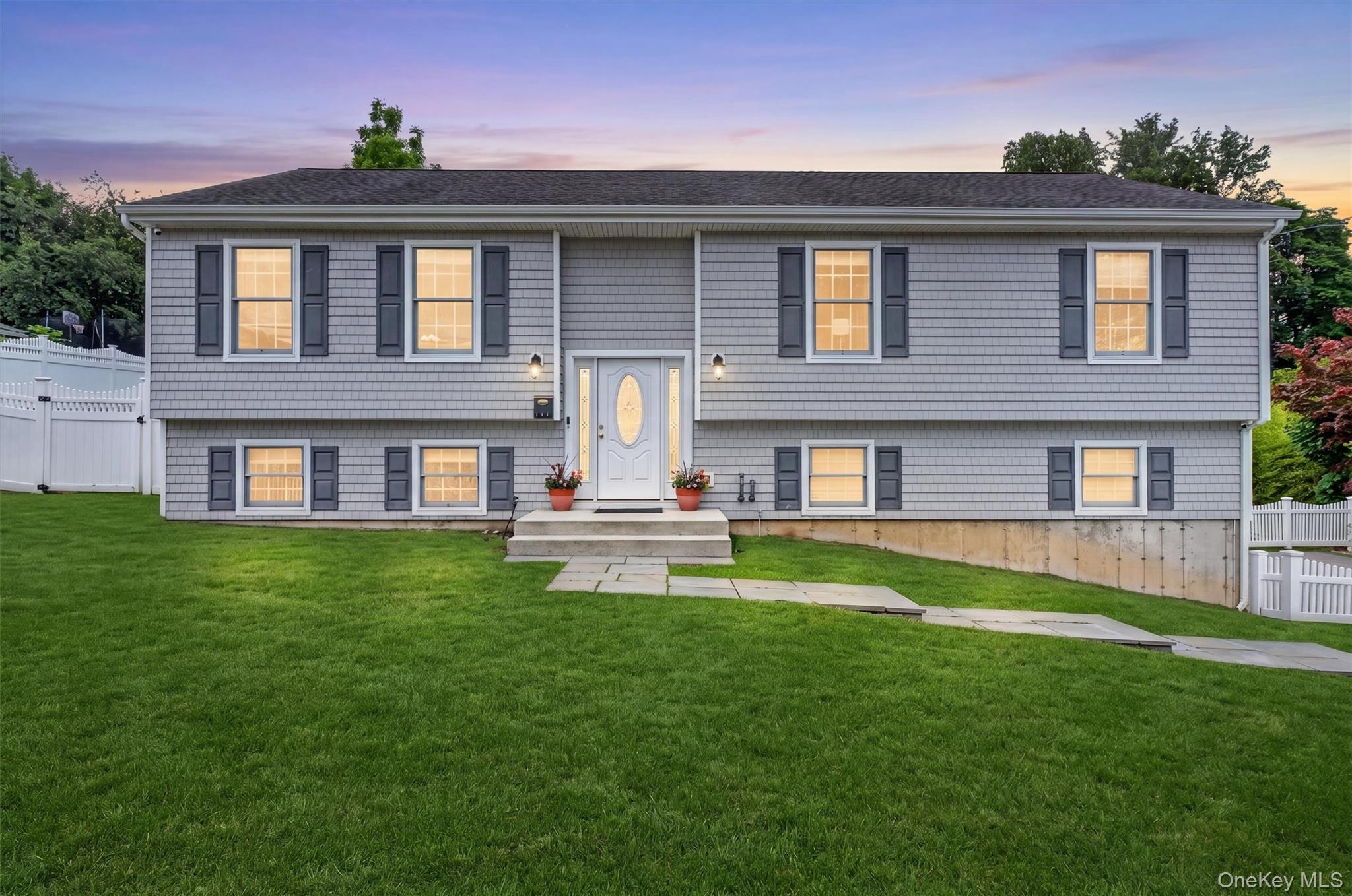 Move right into this beautiful sun-filled raised ranch home built in 2015 and set on .44 private acres in Buchanan Village. The open concept main level features hardwood flooring, a spacious living room and formal dining room with sliding glass door leading to a large composite deck overlooking the fenced backyard. Enjoy outdoor entertaining with a heated partially in-ground pool surrounded by an additional composite deck. The custom gourmet kitchen offers granite countertops, stainless steel appliances, abundant cabinetry and a large center island with seating. Great layout for entertaining or everyday living. The primary suite features a private bathroom, while two additional spacious bedrooms and a full hall bathroom complete the main level. The lower level with laminate flooring offers a large family room, laundry room, utilities and a spacious area with potential for a future bathroom. Door to backyard. Additional features include alarm system and oversized two-car garage. Enjoy Village of Buchanan recreation including pool, tennis, pavilion, playground and fields. Walk to shops and restaurants. Enjoy nearby Hudson River activities, hiking and biking trails, and many local golf courses. Conveniently located just 2.2 miles to the Cortlandt Manor Metro-North train station with under an hour commute to NYC. Close to parks and major highways.