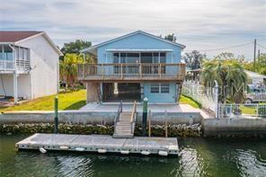 Escape to your very own piece of paradise with this inviting 2-bedroom, 2-bathroom home nestled in a serene waterfront setting. Just a short boat ride away from open waters, this property offers the perfect blend of tranquility and adventure. Imagine waking up to the gentle sounds of the waves lapping against the shore, with sunshine streaming through the windows to greet you each morning. Step outside onto your spacious open porch, where you can savor your morning coffee while watching the world come alive with vibrant colors. As the day unfolds, indulge in outdoor activities like fishing, boating, or simply lounging in the sun. And when evening approaches, there's no better place to unwind than on your porch, where you can witness breathtaking sunsets painting the sky with hues of orange, pink, and purple. Inside, the home boasts an open floor plan that seamlessly connects the living, dining, and kitchen areas, creating the perfect space for entertaining guests or simply enjoying quiet evenings at home. With ample natural light and panoramic views of the surrounding landscape, every moment spent indoors feels like a retreat. Ready to make this dream a reality? Don't hesitate—schedule your private showing today and discover why this waterfront oasis is the perfect place to call home. **Move in Ready **All information to be verified